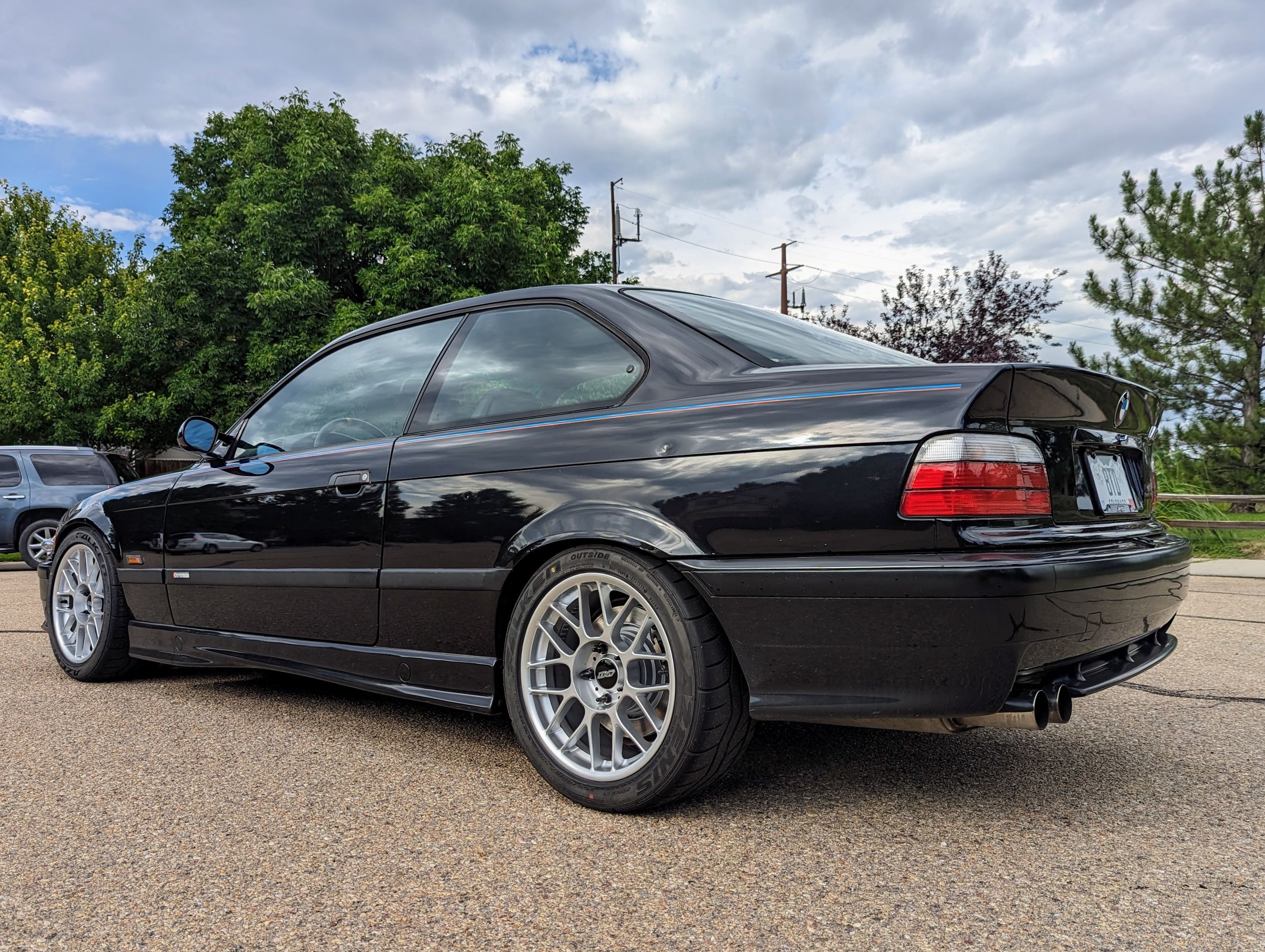 Black BMW E36 M3 with 17" ARC-8 Apex wheels in Hyper Silver