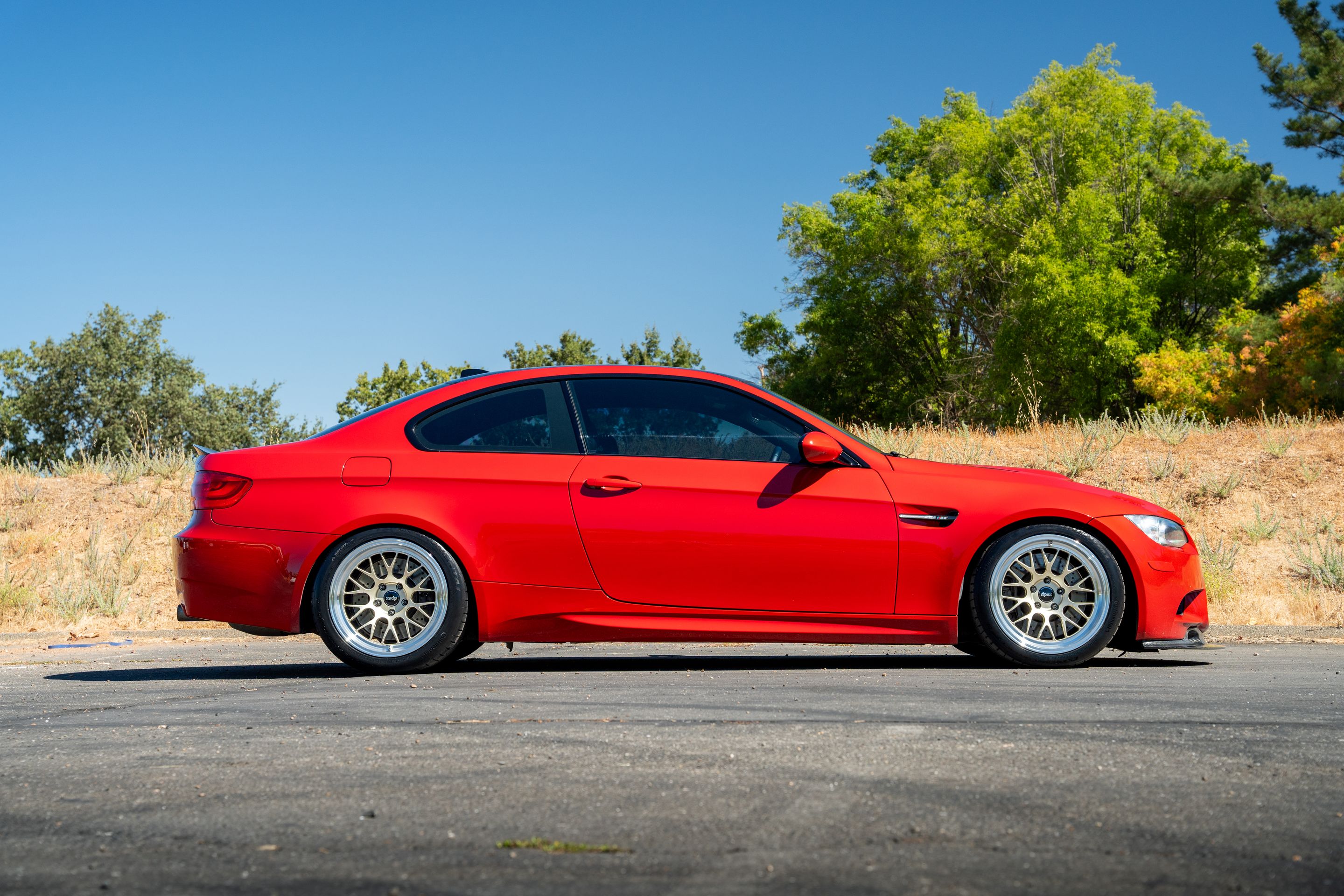 Red BMW E92 Coupe M3 with 18" ML-10RT Apex wheels in Machined Lip Gloss Motorsport Gold