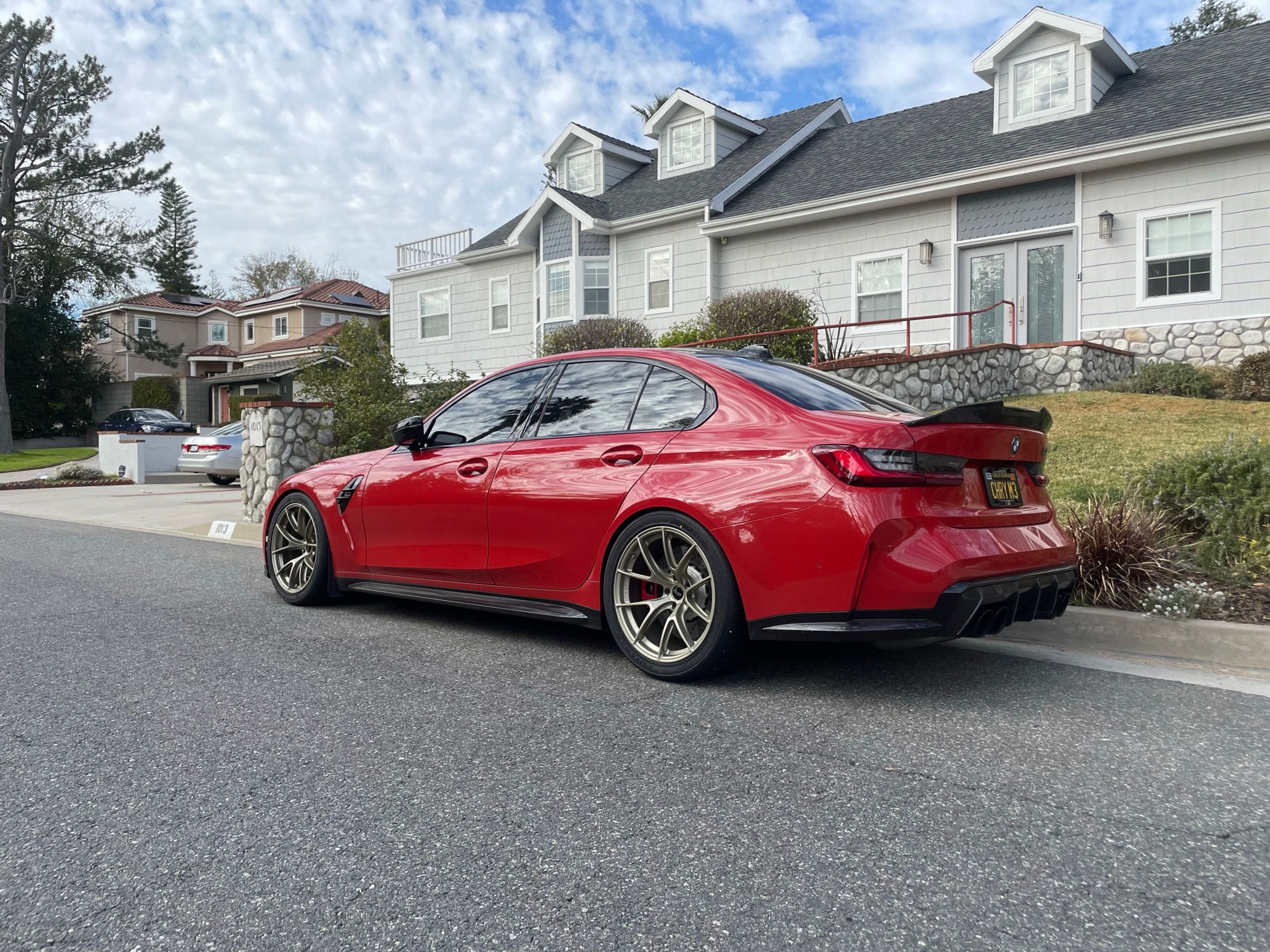 Red BMW G80 M3 with 19" VS-5RS Apex wheels in Motorsport Gold