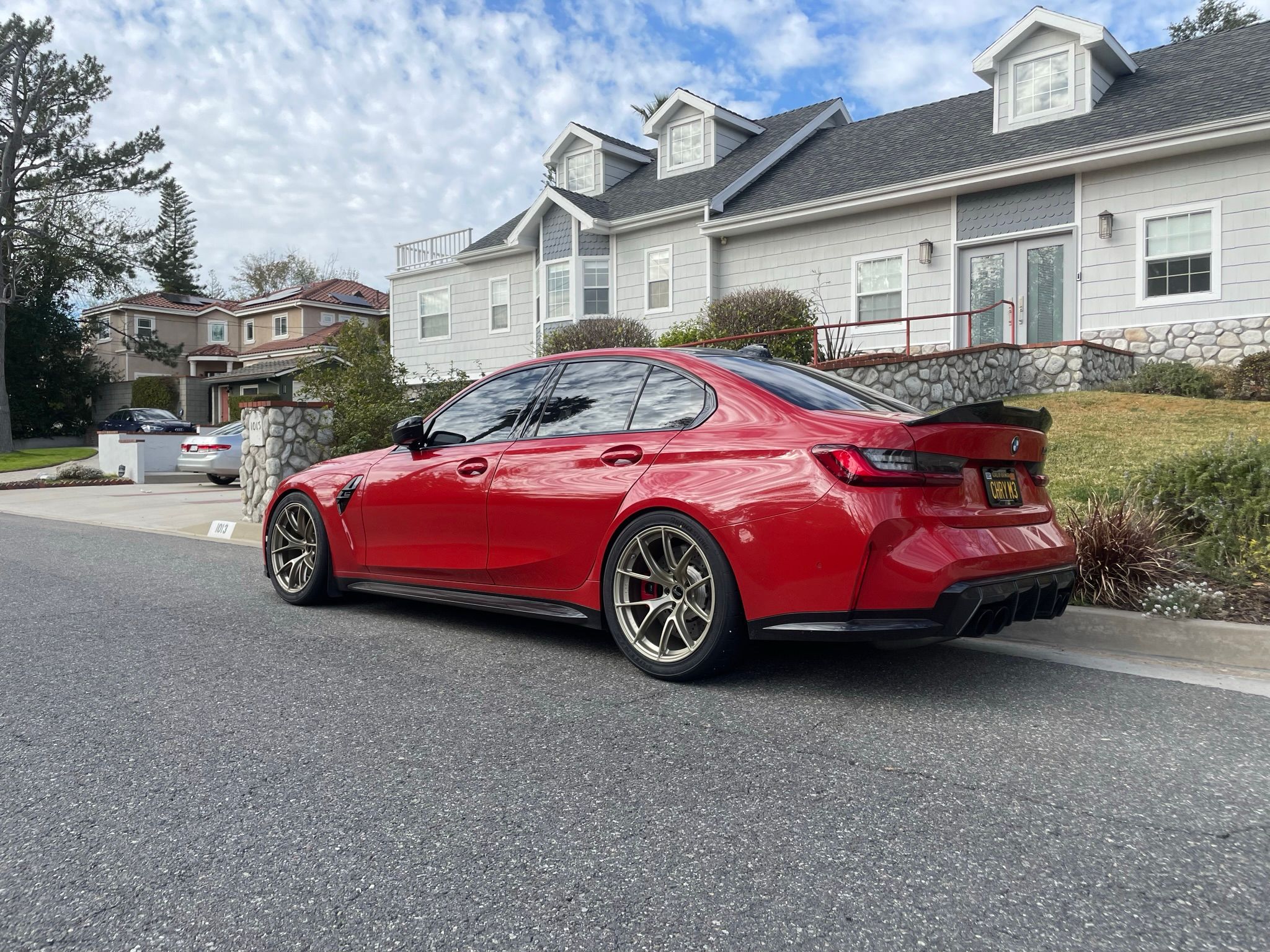 Red BMW G80 M3 with 19" VS-5RS Apex wheels in Motorsport Gold