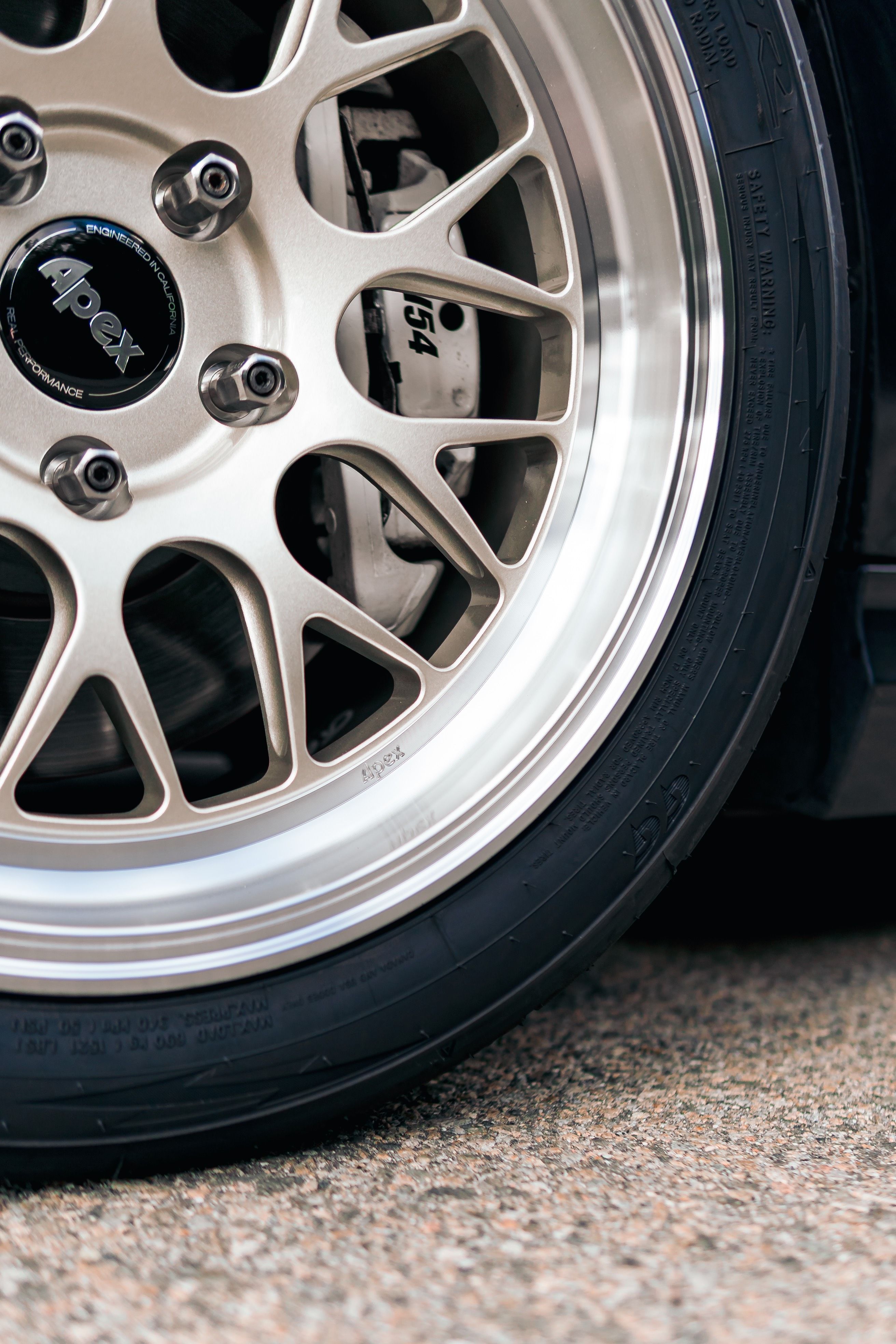 Black BMW E90 Sedan 3 Series with 17" ML-10RT Apex wheels in Machined Lip Gloss Motorsport Gold