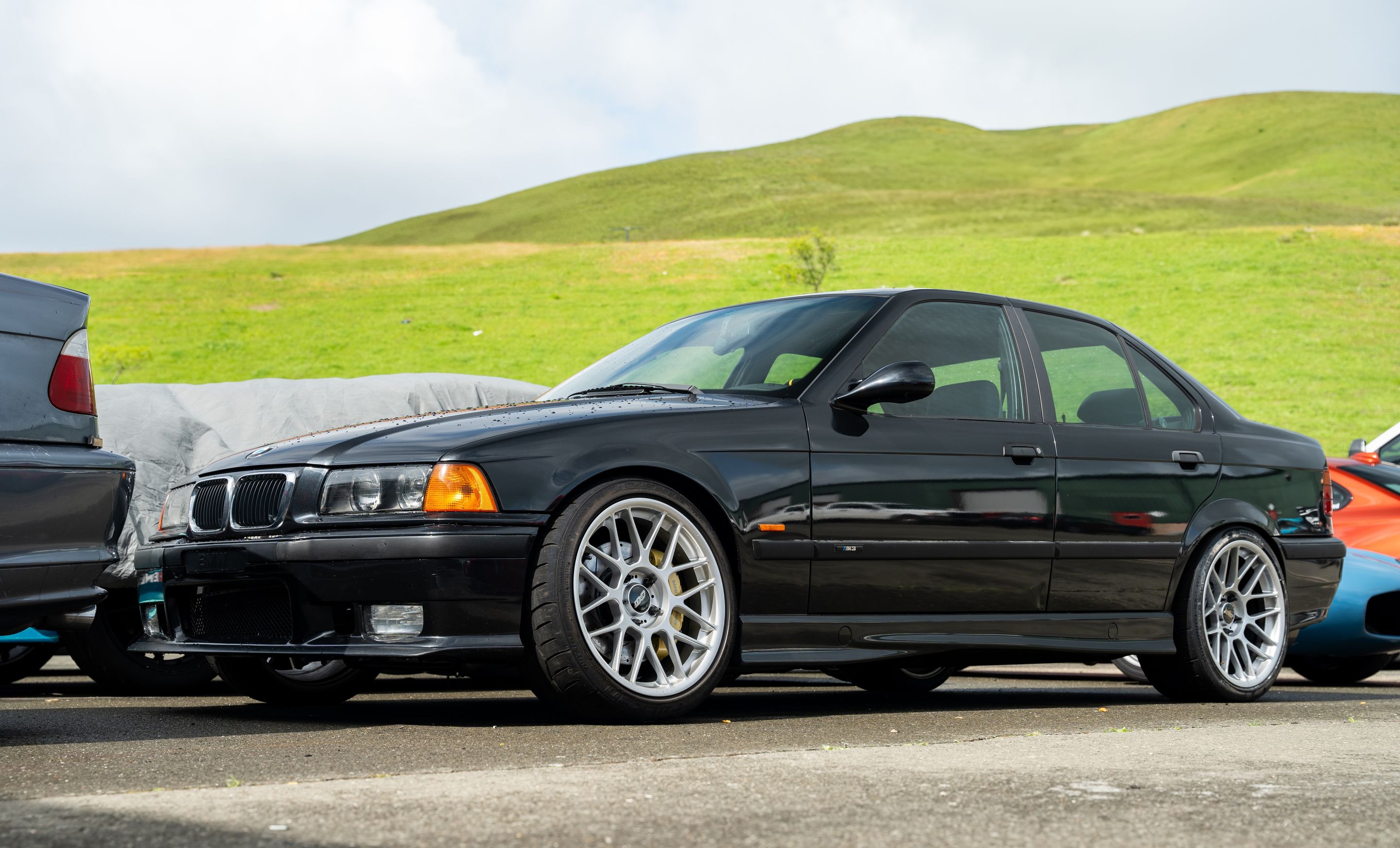 Black BMW E36 M3 with 18" ARC-8 Apex wheels in Race Silver