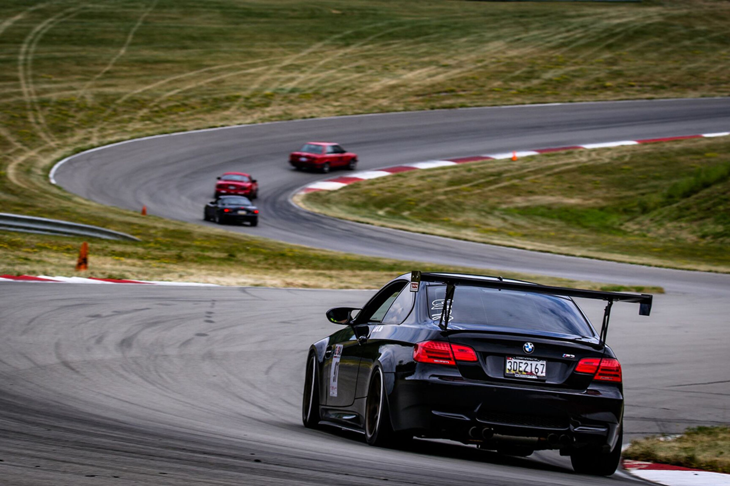 Black BMW E92 Coupe M3 with 18" ARC-8 Apex wheels in Satin Bronze