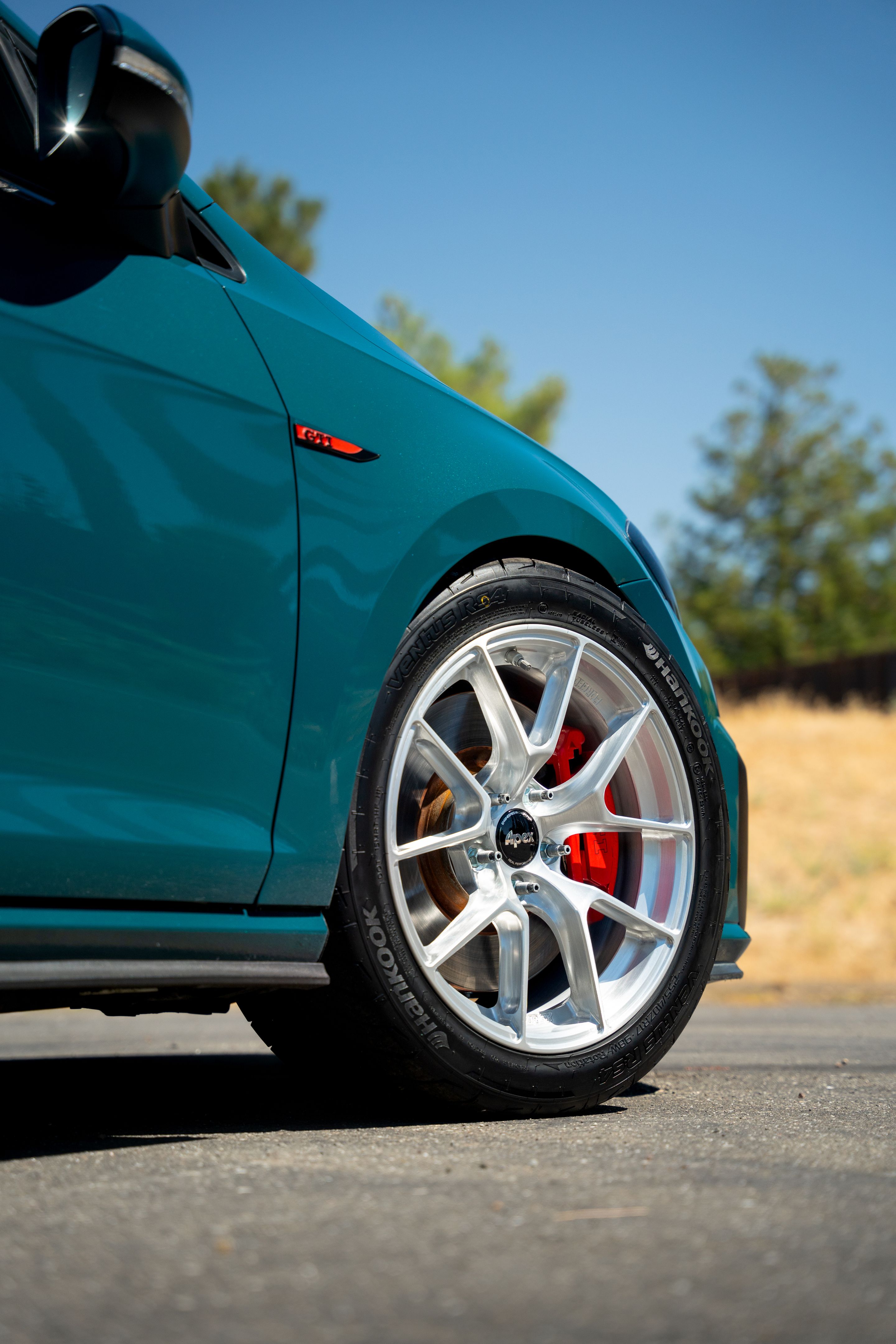 Green VW MK7 GTI with 17" VS-5RS Apex wheels in Brushed Clear