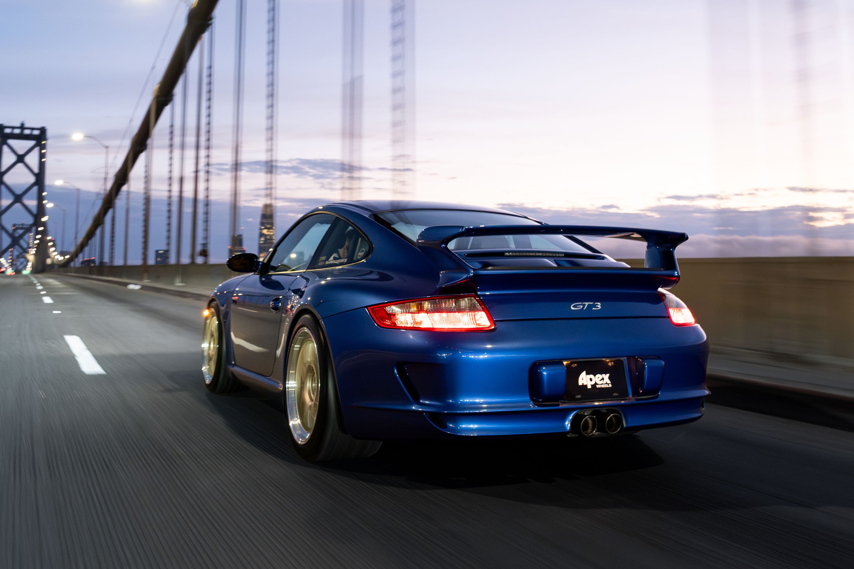Blue Porsche 911 997 GT3 with 19" TEST-M Apex wheels in Machined Lip Gloss Motorsport Gold