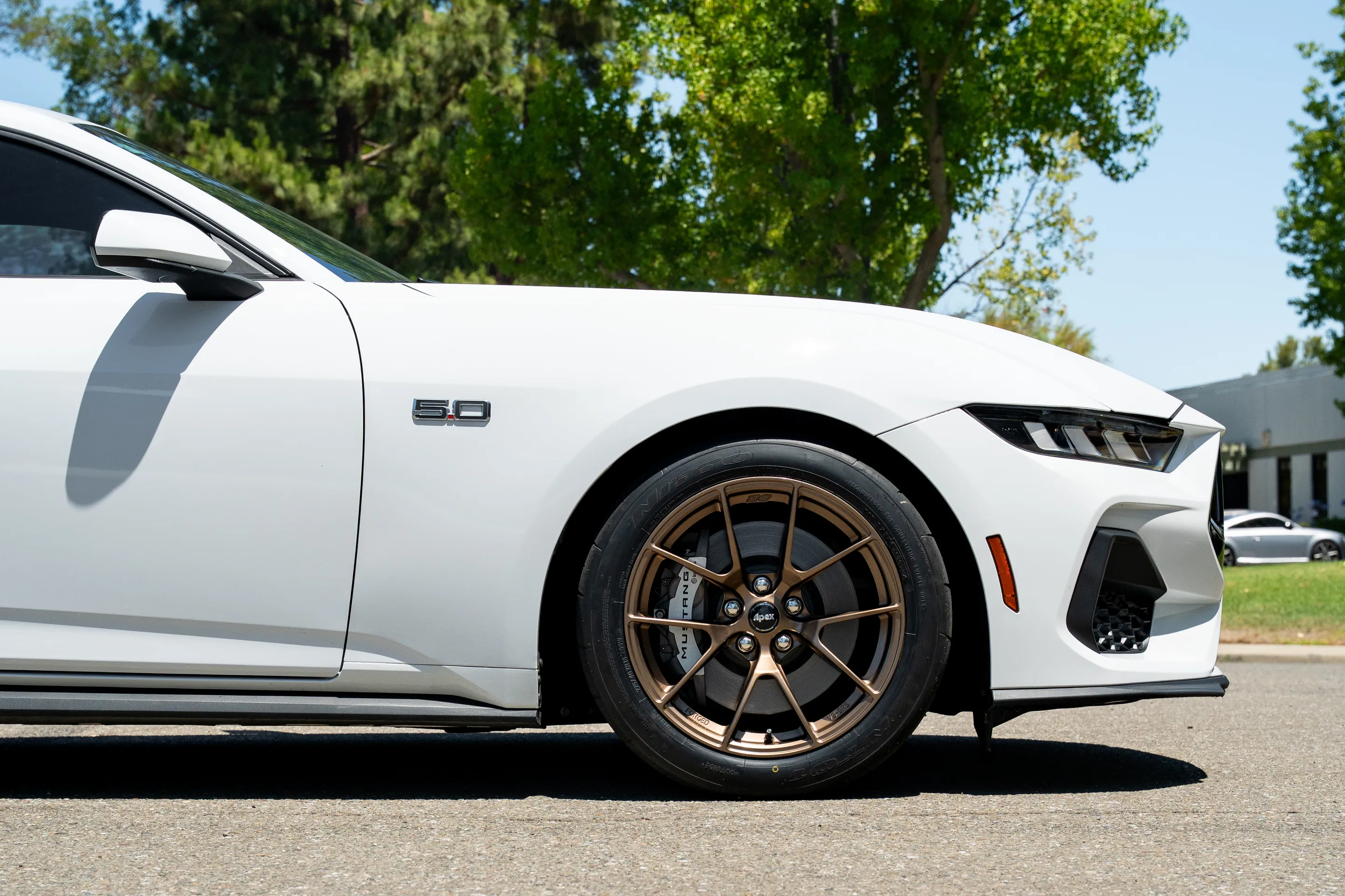 White Ford S650 Mustang GT with 18" VS-5RS Apex wheels in Satin Bronze