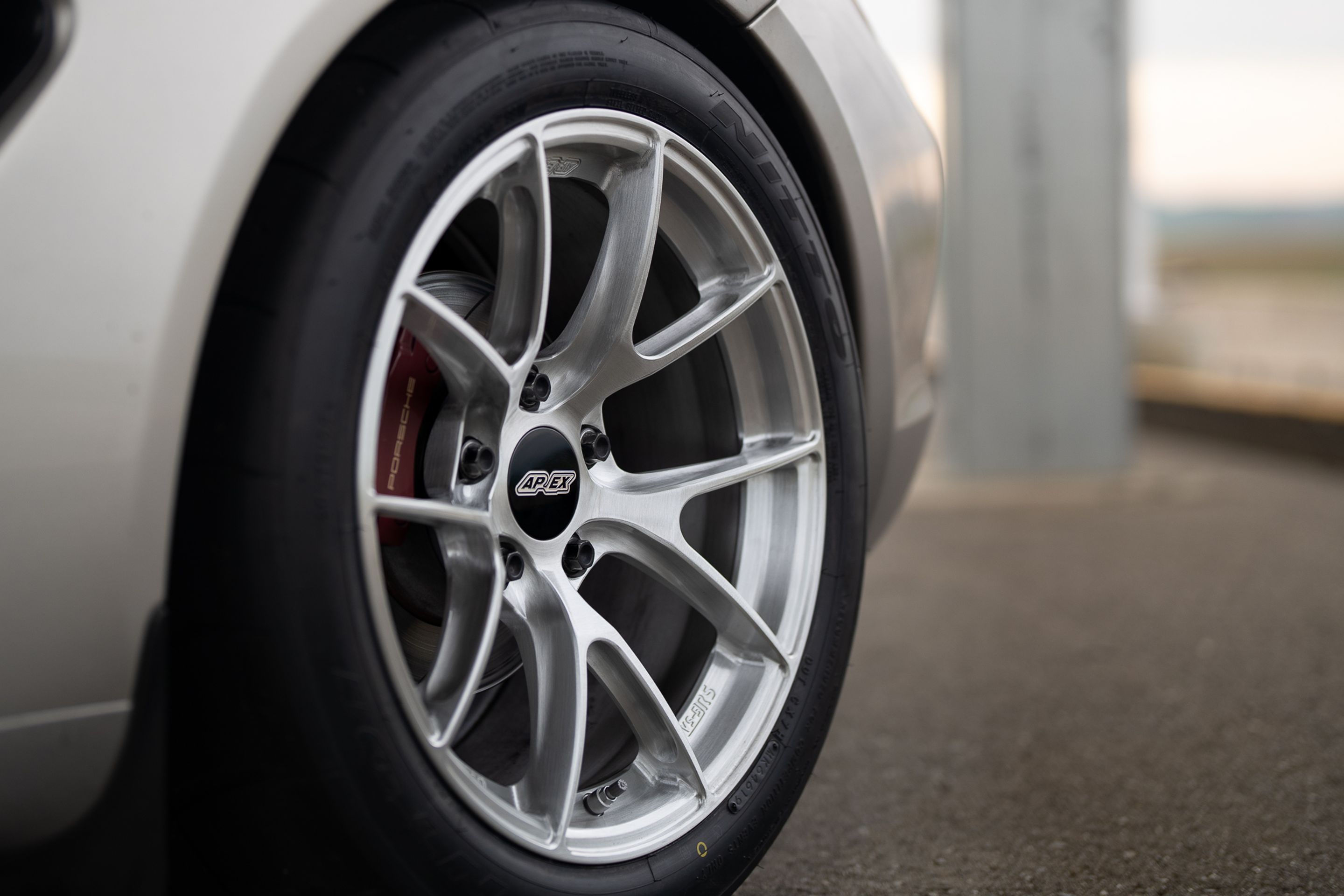 Grey Porsche 987 Cayman R with 18" VS-5RS Apex wheels in Brushed Clear
