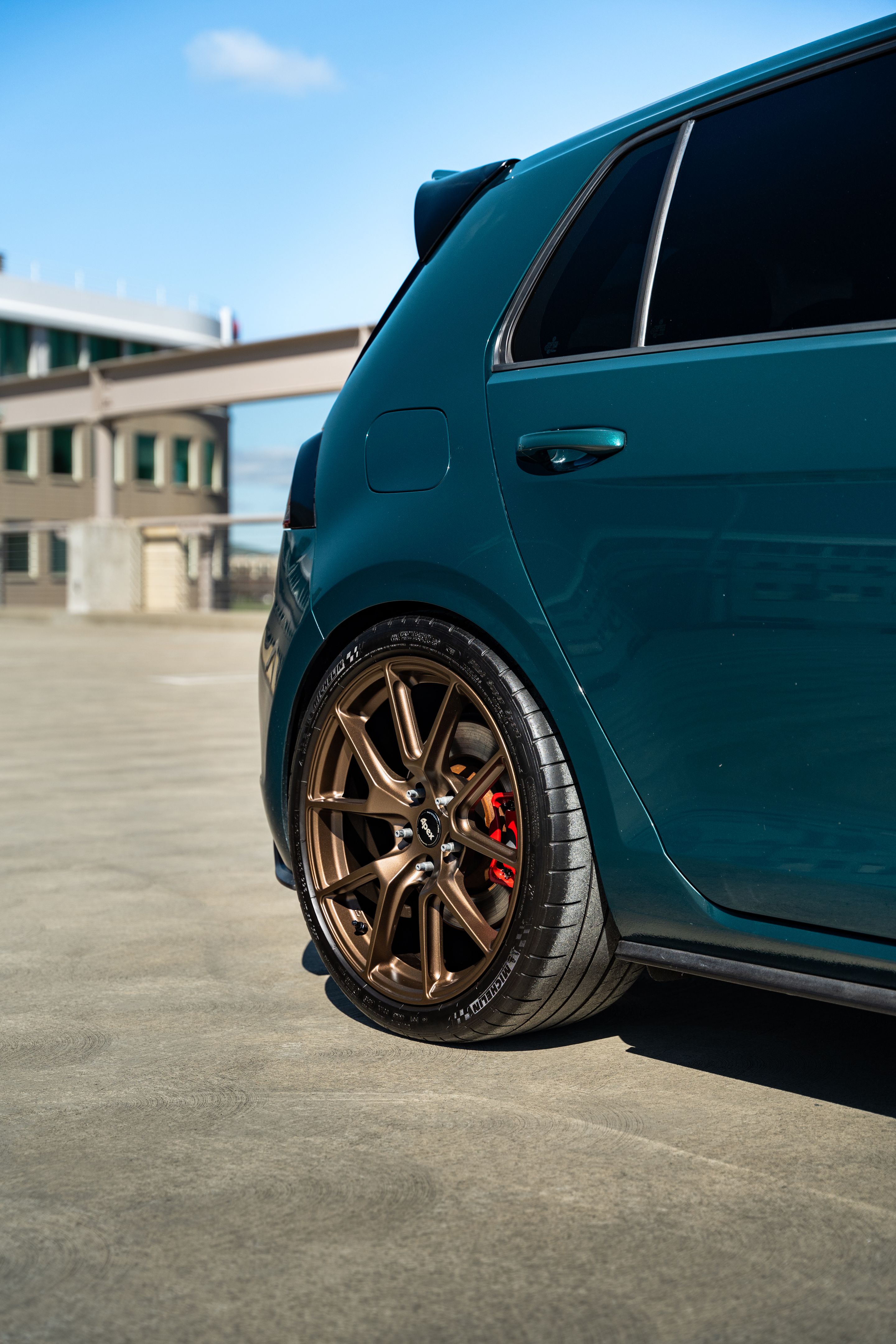 Green VW MK7 GTI with 18" VS-5 Apex wheels in Satin Bronze