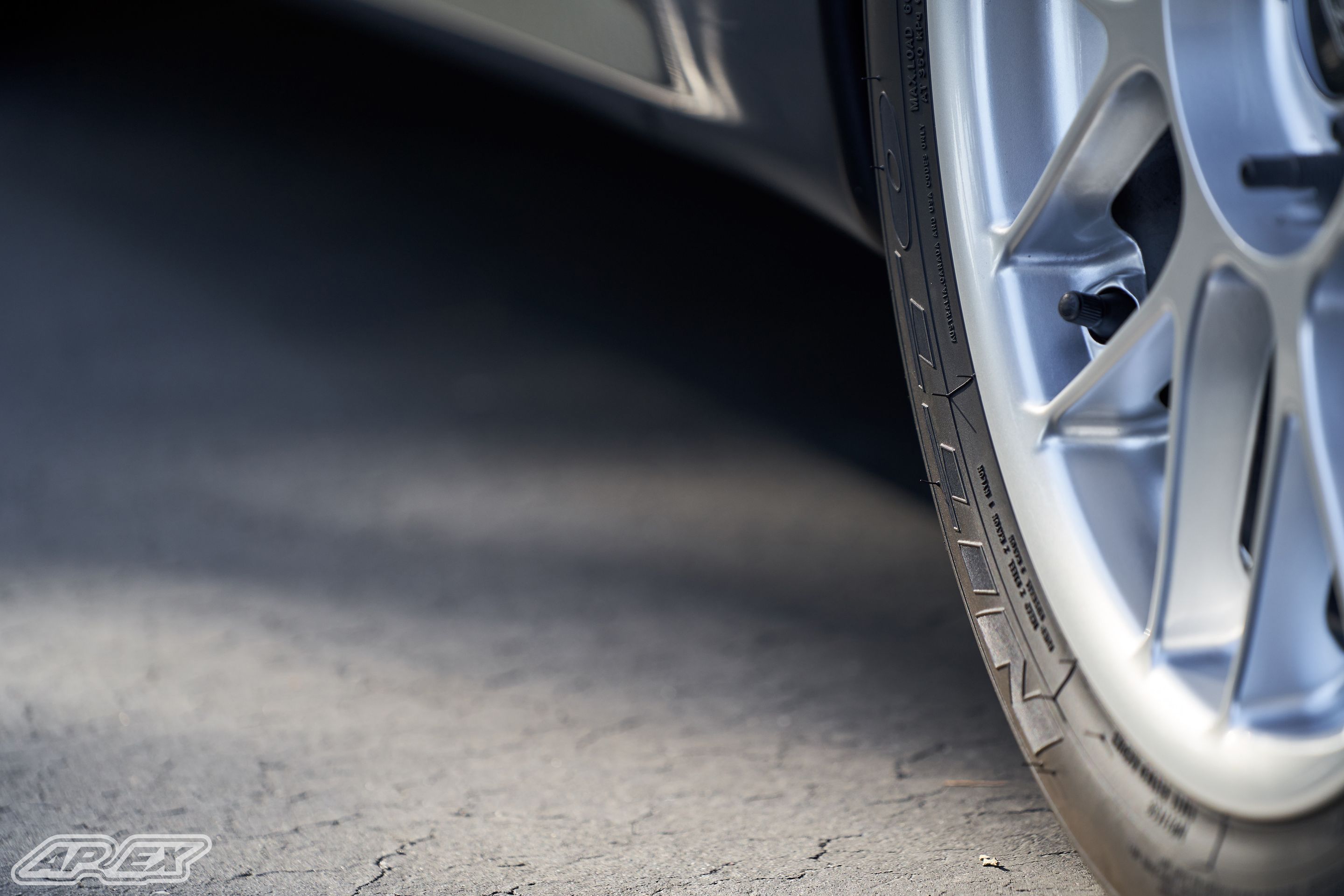 Black BMW E30 M3 with 17" ARC-8 Apex wheels in Hyper Silver