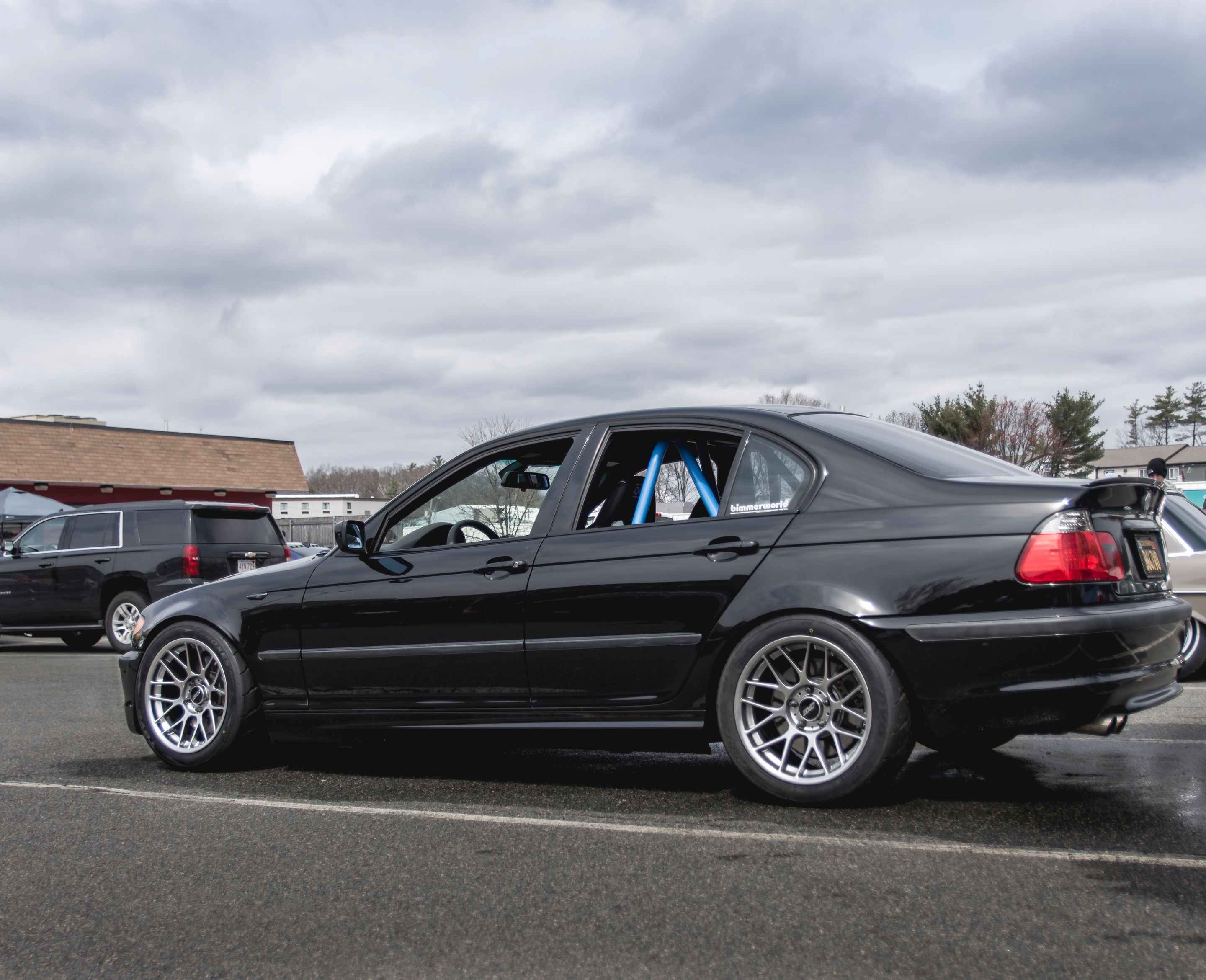 Black BMW E46 3 Series with 17" ARC-8 Apex wheels in Hyper Black