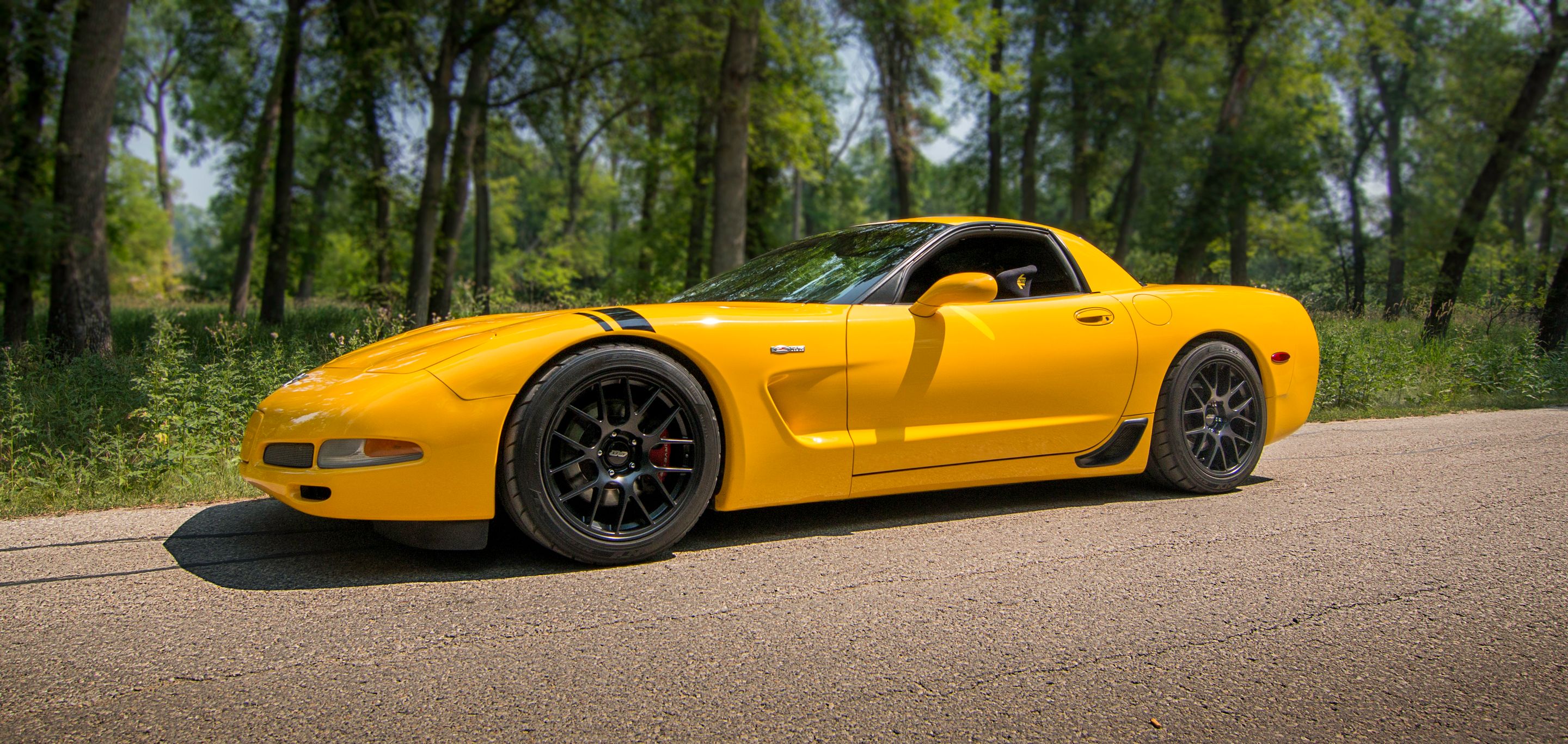 Yellow Chevrolet C5 Corvette Z06 with 18" EC-7 Apex wheels in Satin Black