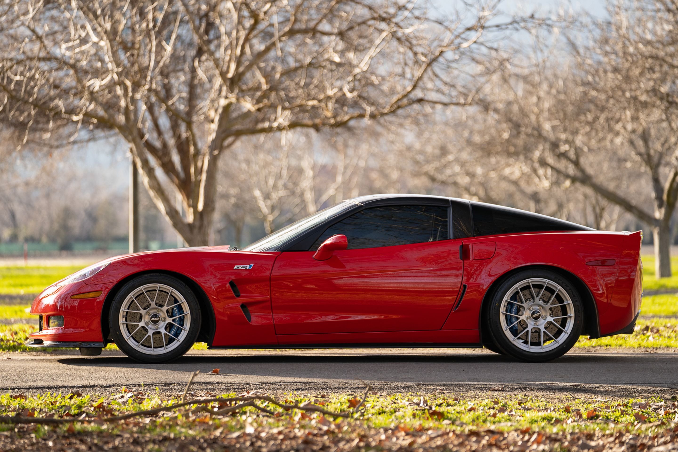 Red Chevrolet C6 Corvette ZR-1 with 18"/19" EC-7RS Apex wheels in Brushed Clear