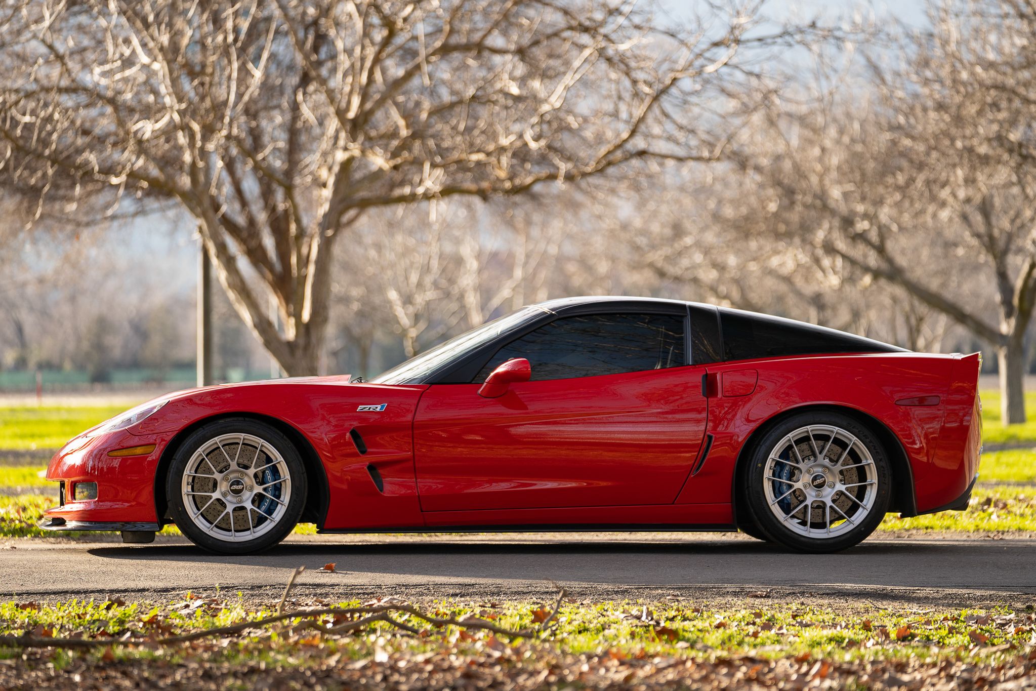 Red Chevrolet C6 Corvette ZR-1 with 18"/19" EC-7RS Apex wheels in Brushed Clear