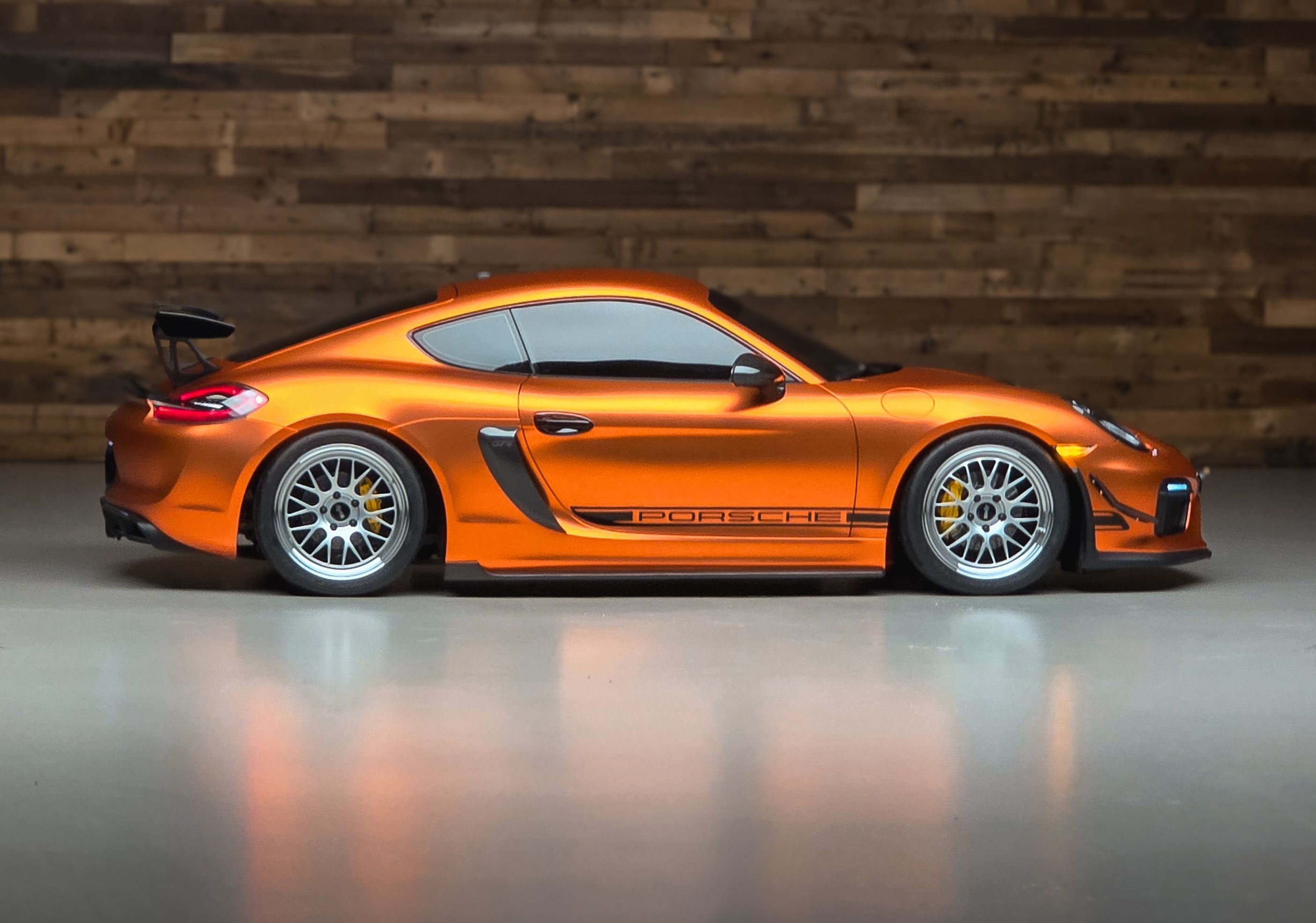 Orange Porsche 981 Cayman GT4 with 19" ML-10RT Apex wheels in Machined Lip Race Silver
