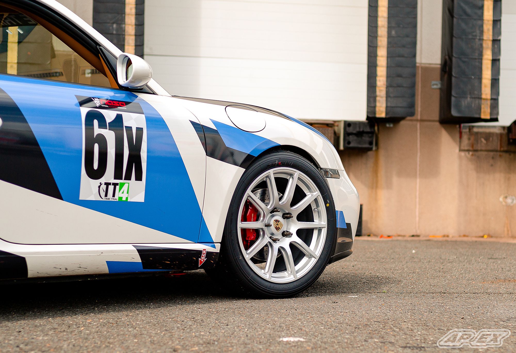 White Porsche 987 Cayman S with 18" SM-10 Apex wheels in Race Silver