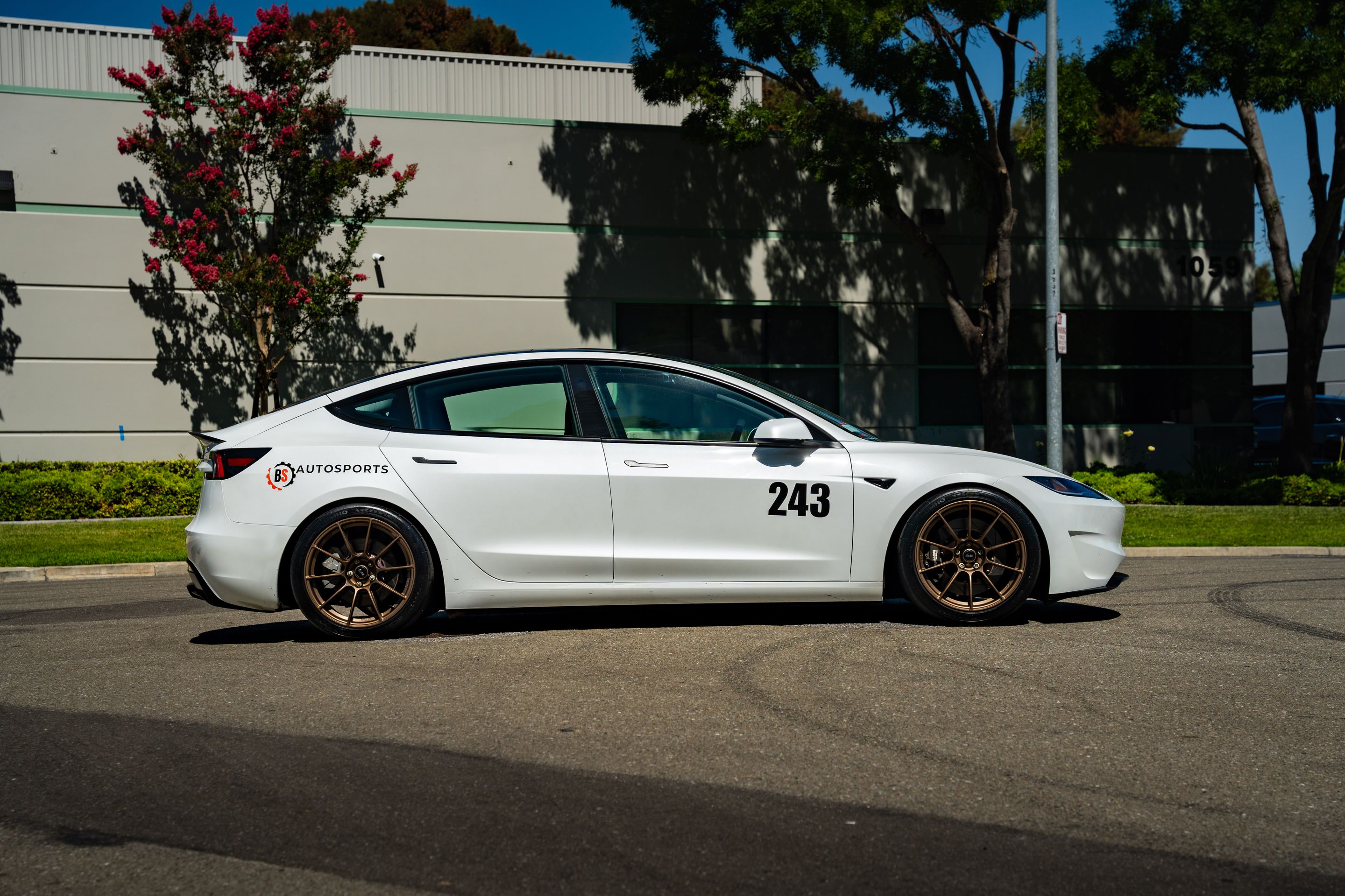 White Tesla Model 3 with 19" SM-10RS Apex wheels in Satin Bronze