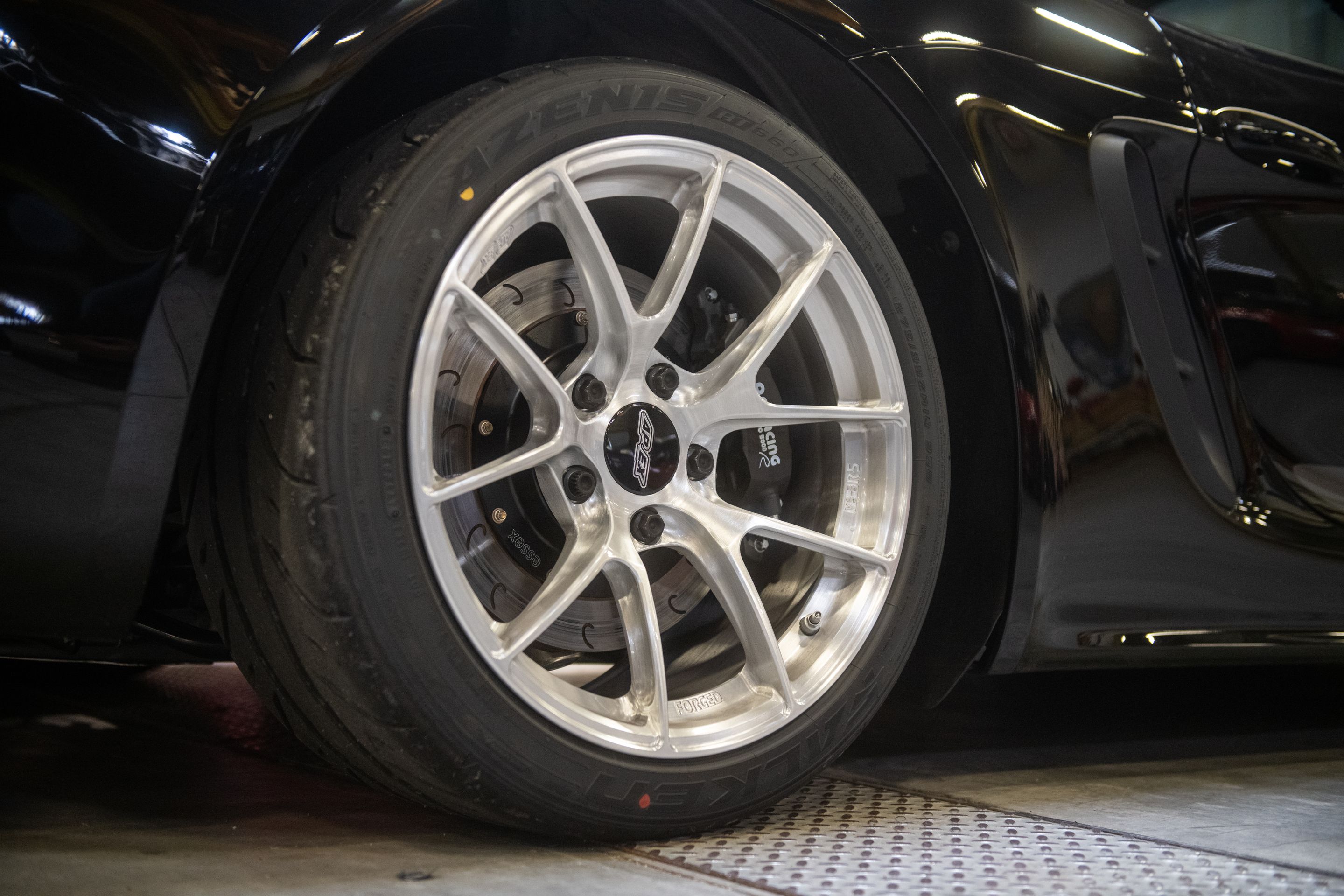 Black Porsche 718 Cayman T with 18" VS-5RS Apex wheels in Brushed Clear