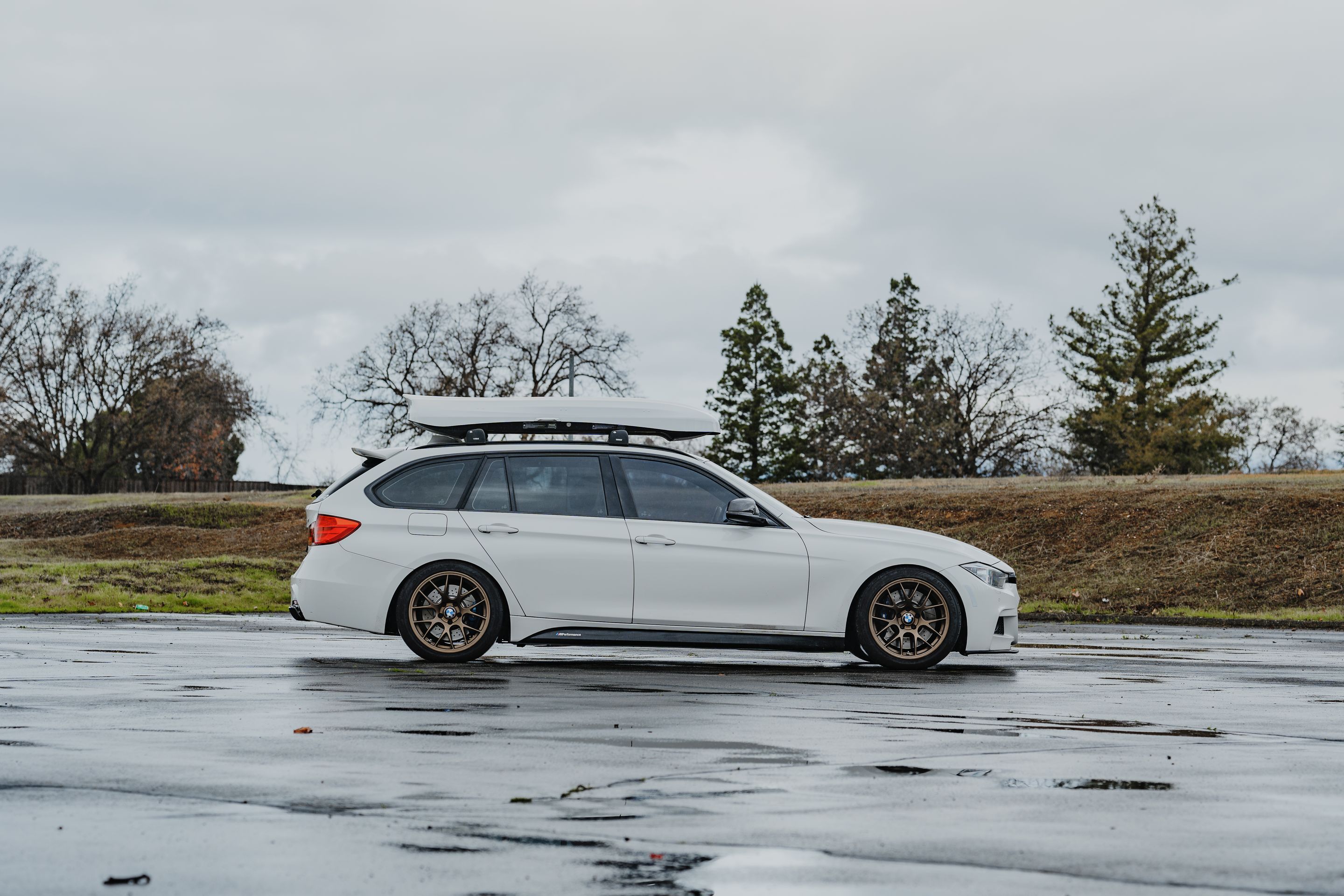 White BMW F31 Wagon 3 Series with 18" EC-7 Apex wheels in Satin Bronze