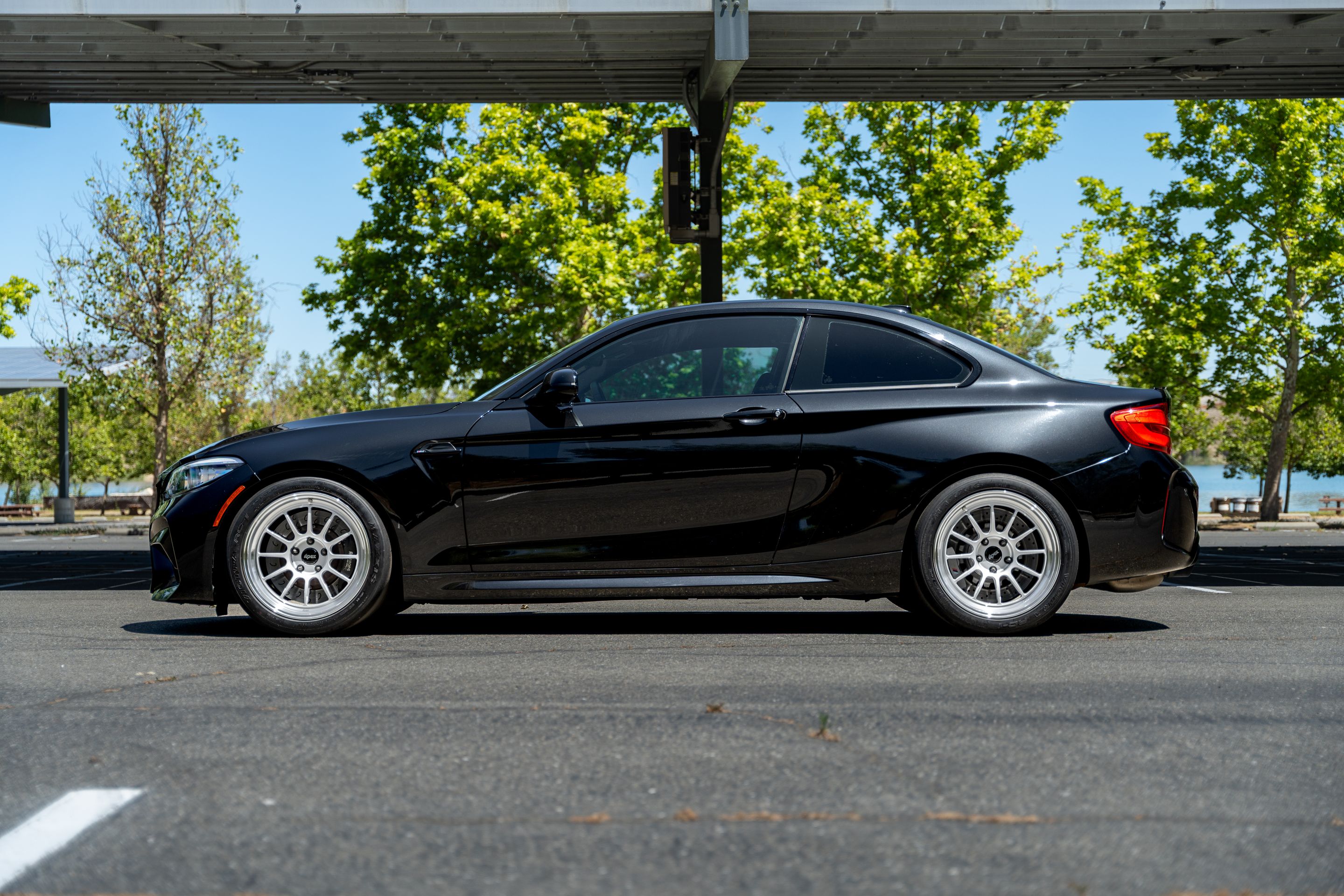 Black BMW F87 M2 with 18" SL-12RT Apex wheels in Machined Lip Race Silver