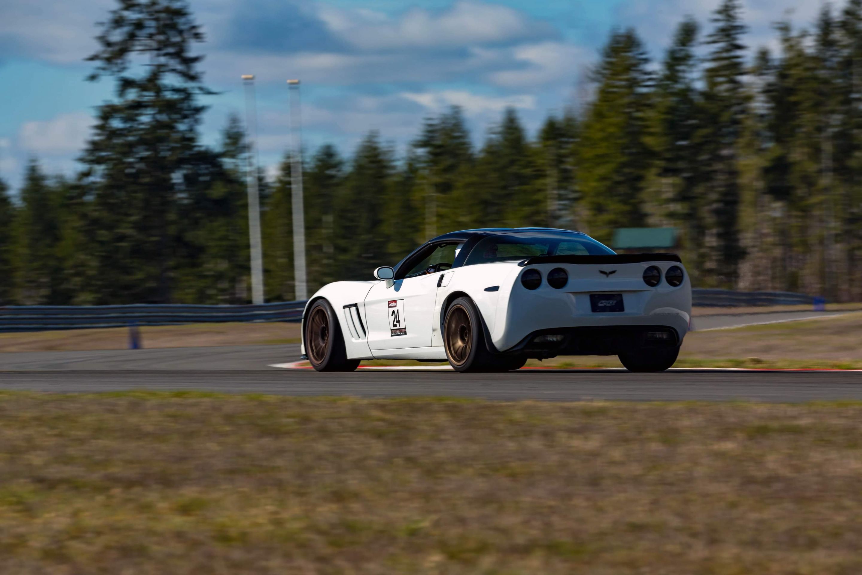 White Chevrolet C6 Corvette Grand Sport with 18" SM-10 Apex wheels in Satin Bronze