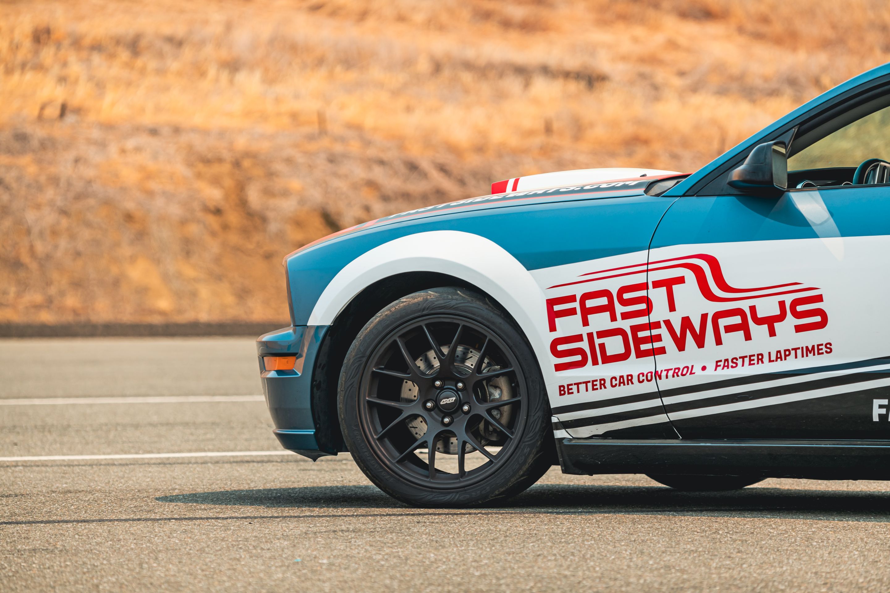 Multicolor Ford S197 Mustang GT with 18" EC-7 Apex wheels in Satin Black