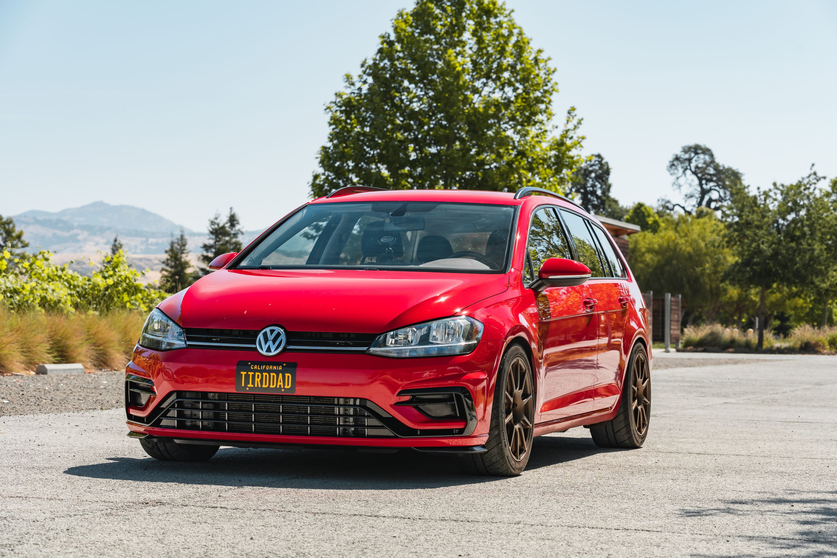 Red VW MK7 Alltrack/SportWagen Golf SportWagen with 17" SM-10 Apex wheels in Satin Bronze