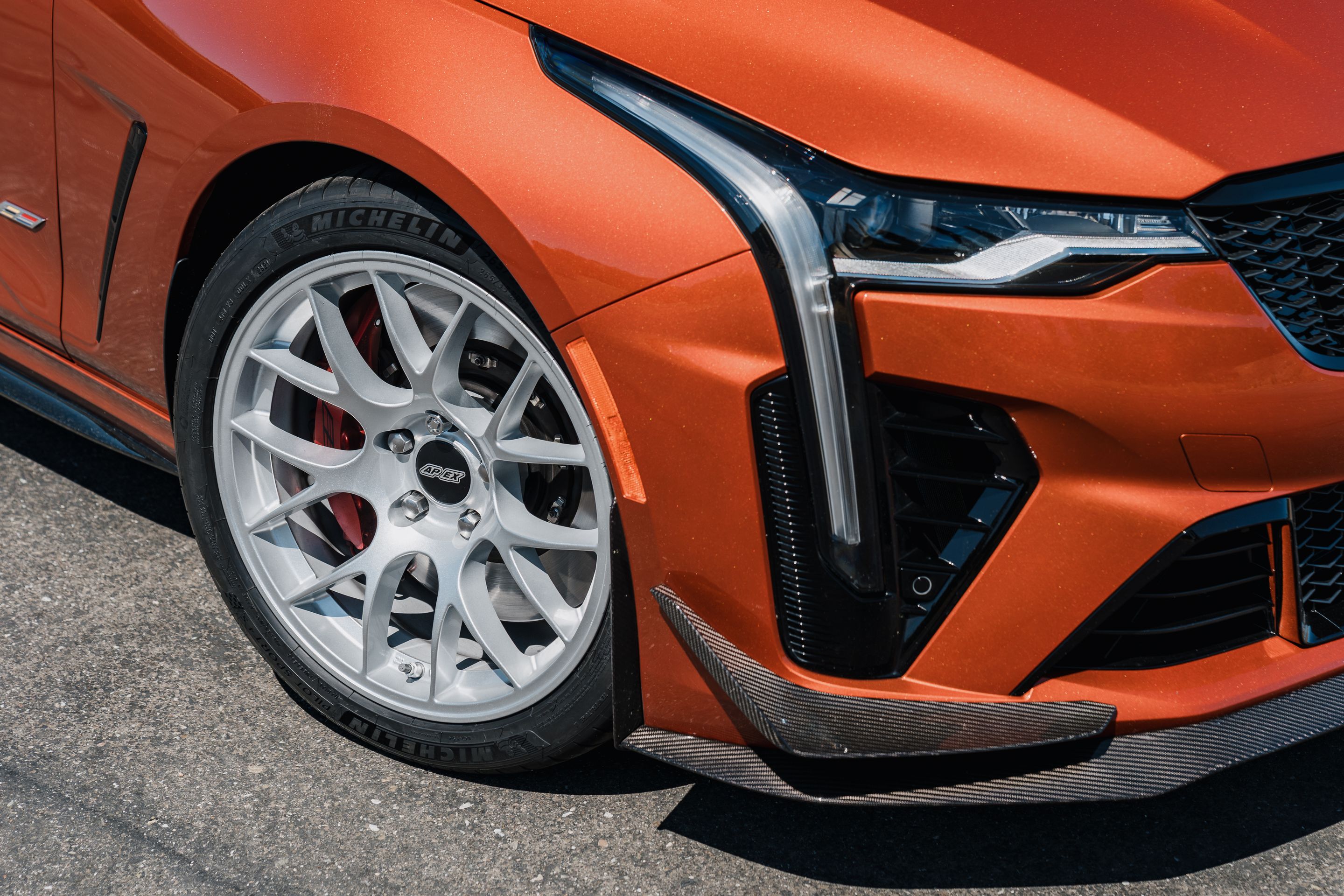 Orange Cadillac CT4-V Blackwing with 18" EC-7 Apex wheels in Race Silver