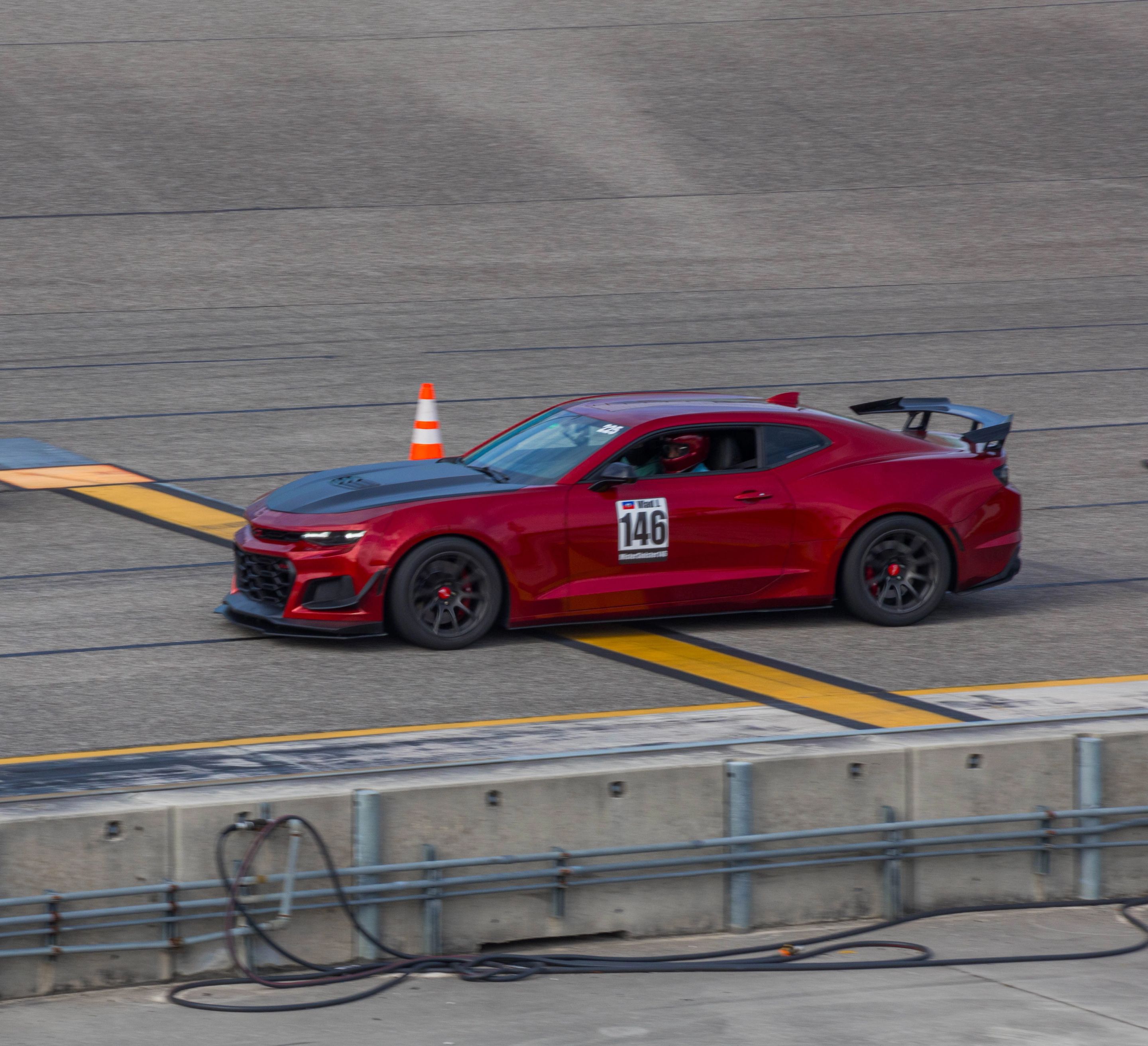 Red Chevrolet 6th Gen Camaro SS with 19" SM-10 Apex wheels in Satin Black