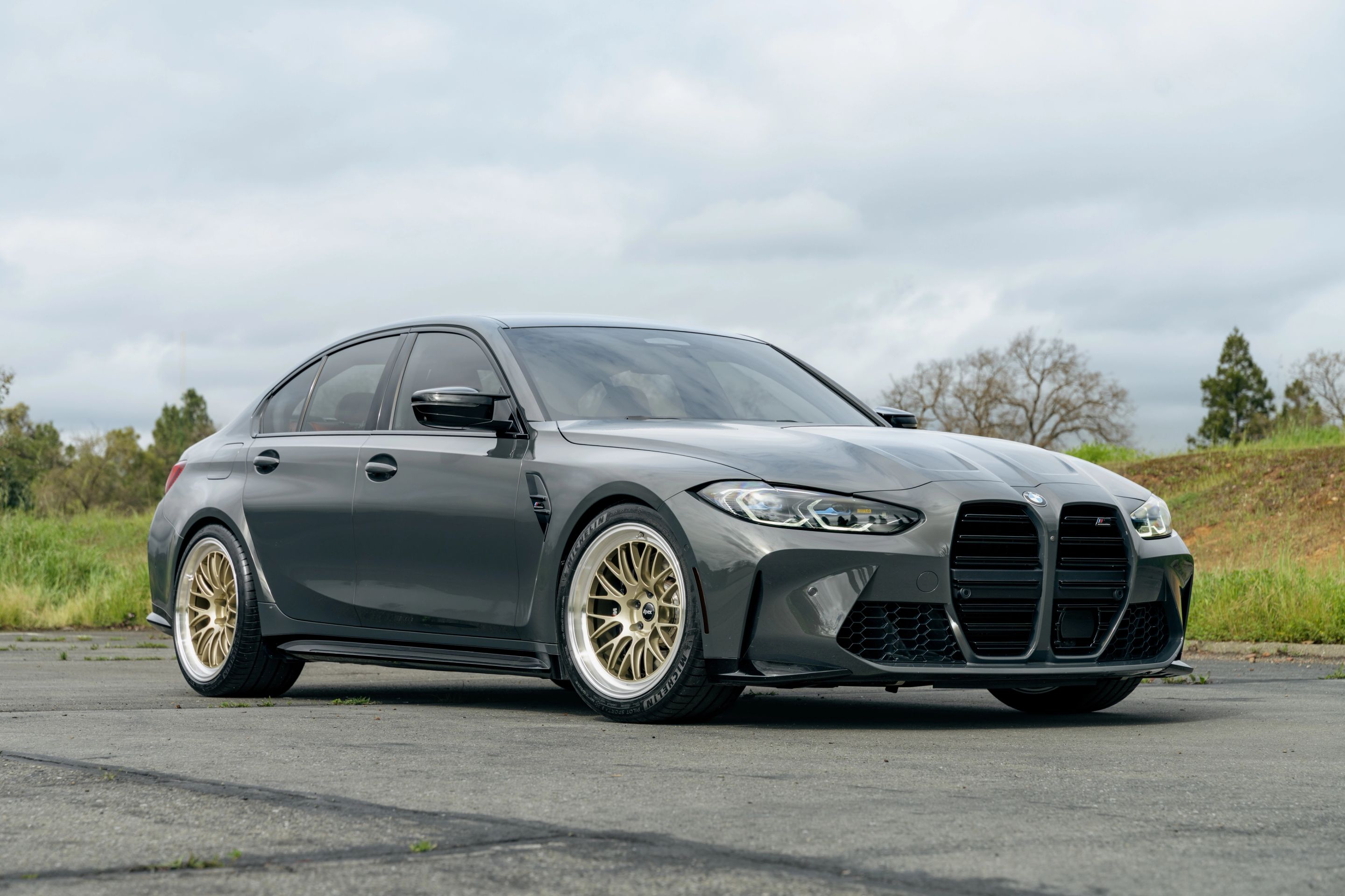 Grey BMW G80 M3 with 19"/20" ML-10RT Apex wheels in Machined Lip Gloss Motorsport Gold