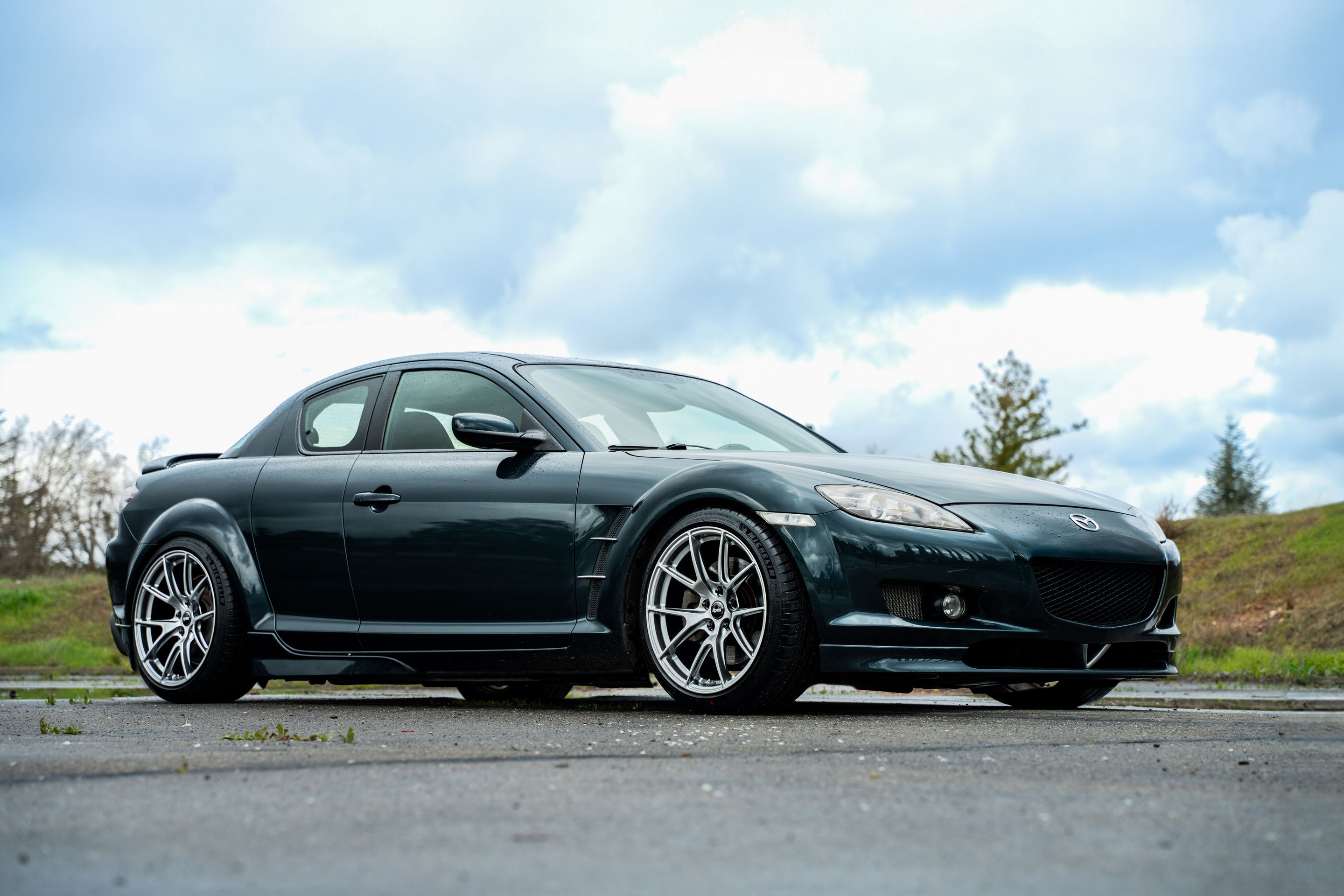 Green Mazda RX-8 with 18" VS-5 Apex wheels in Hyper Black