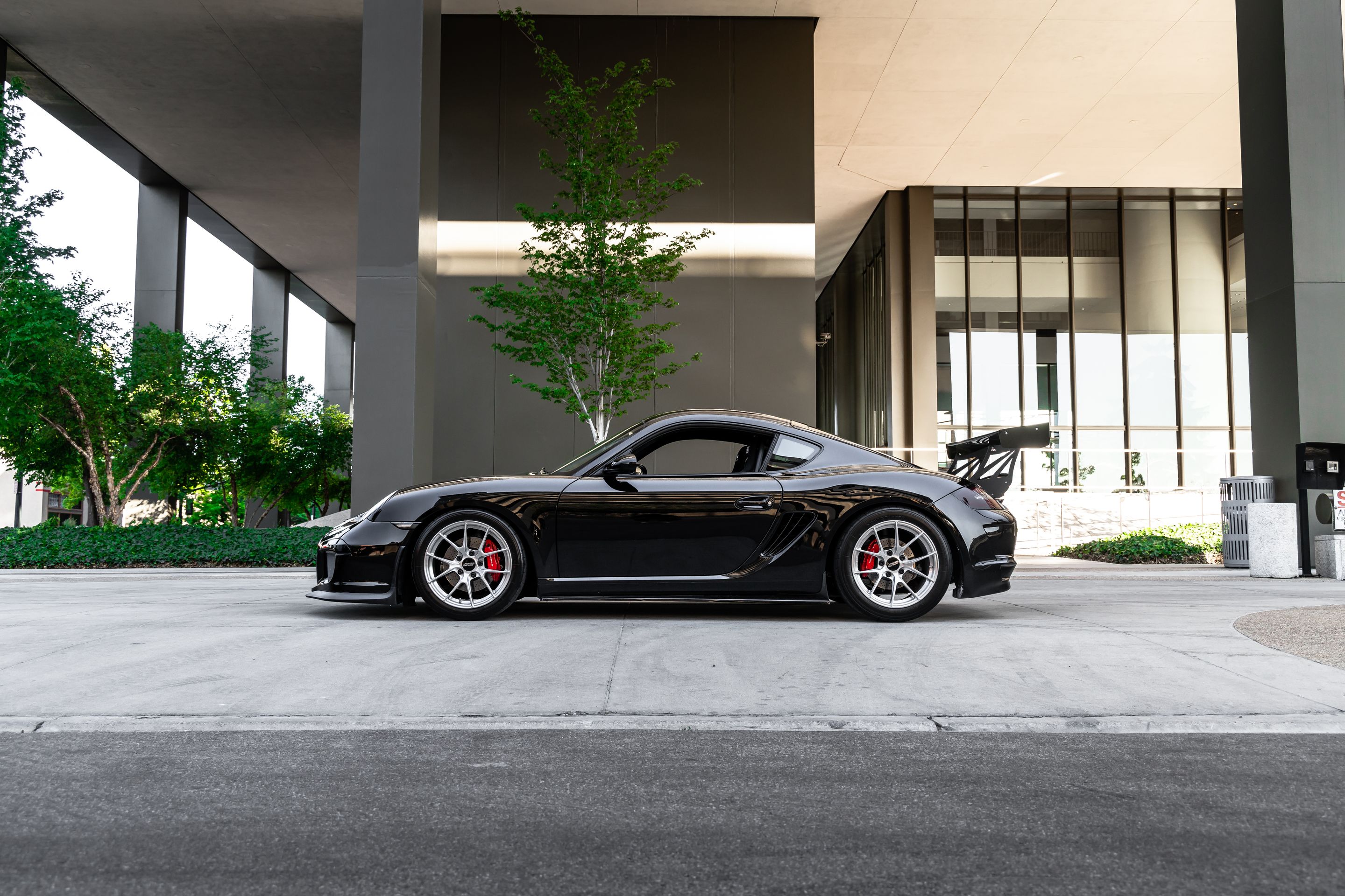 Black Porsche 987 Cayman S with 18" VS-5RS Apex wheels in Brushed Clear