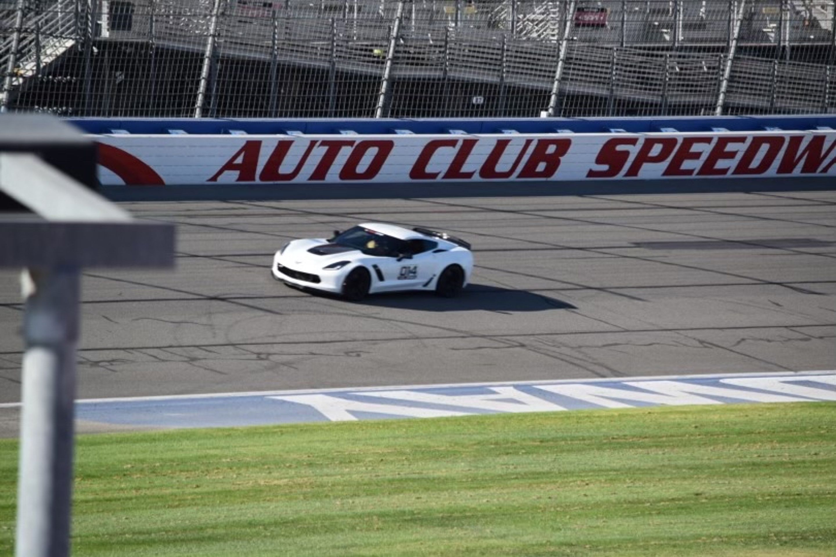 White Chevrolet C7 Corvette Z06 with 19" SM-10 Apex wheels in Satin Black