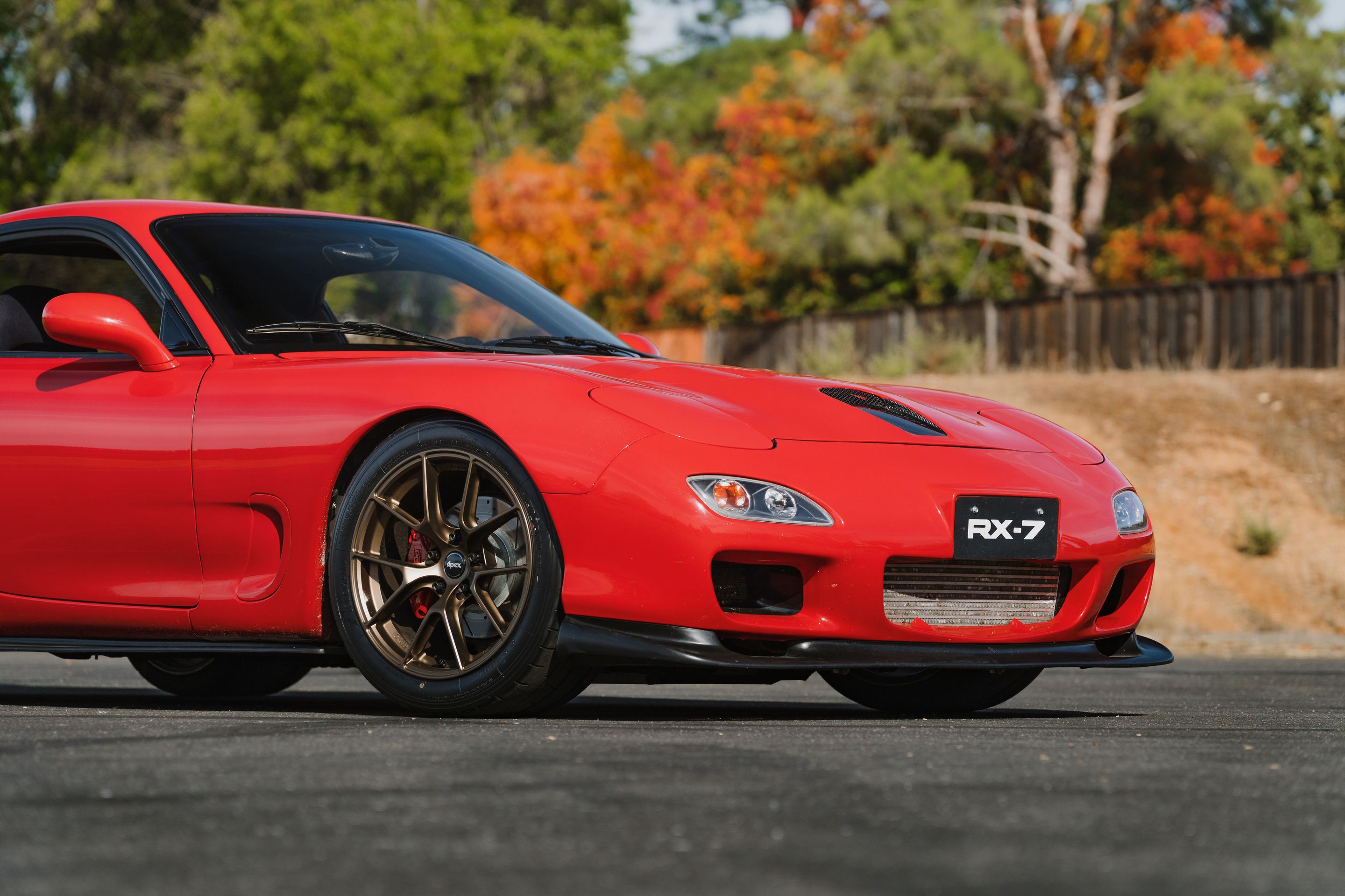 Red Mazda FD RX-7 with 17" VS-5RS Apex wheels in Satin Bronze