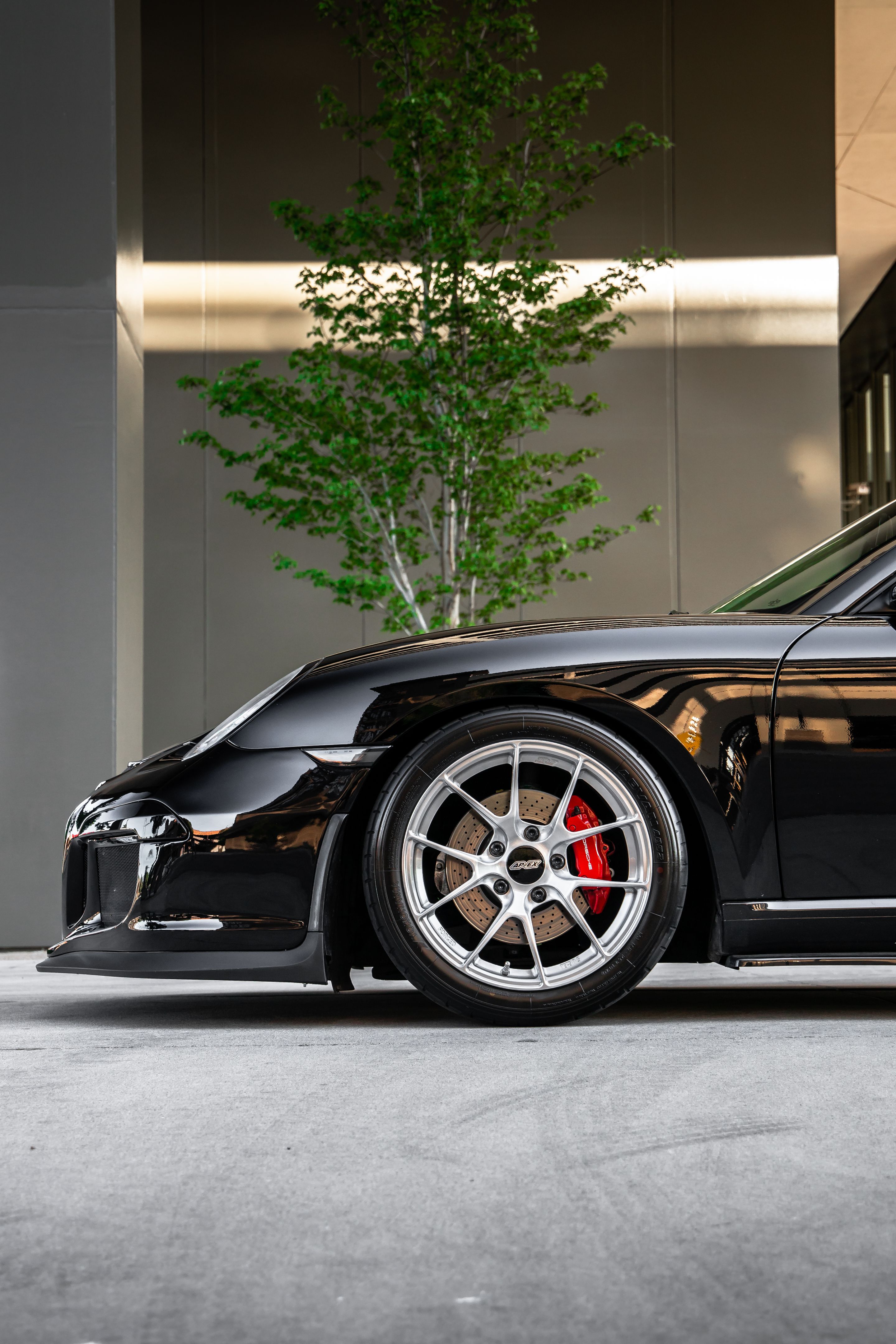 Black Porsche 987 Cayman S with 18" VS-5RS Apex wheels in Brushed Clear
