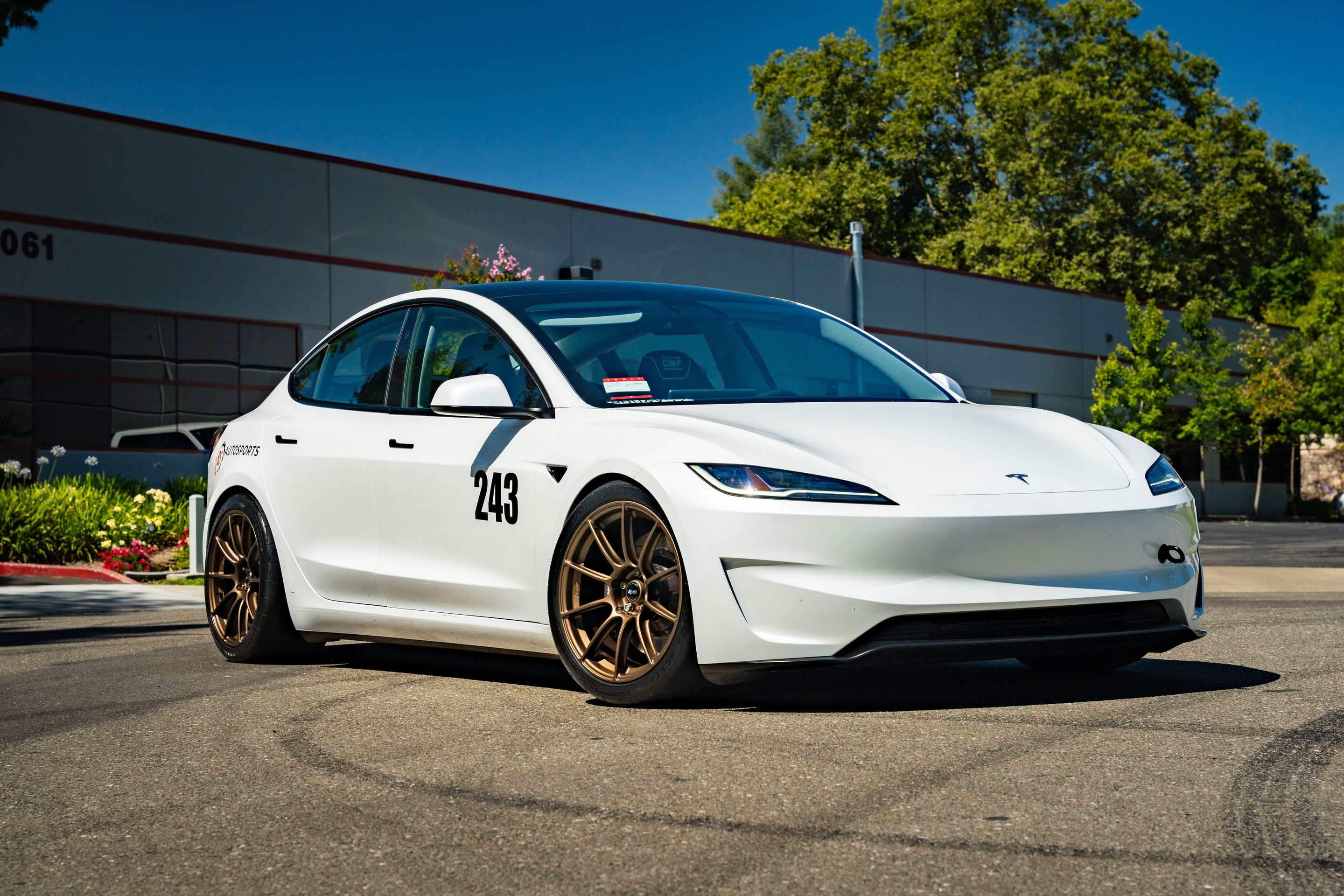 White Tesla Model 3 with 19" SM-10RS Apex wheels in Satin Bronze
