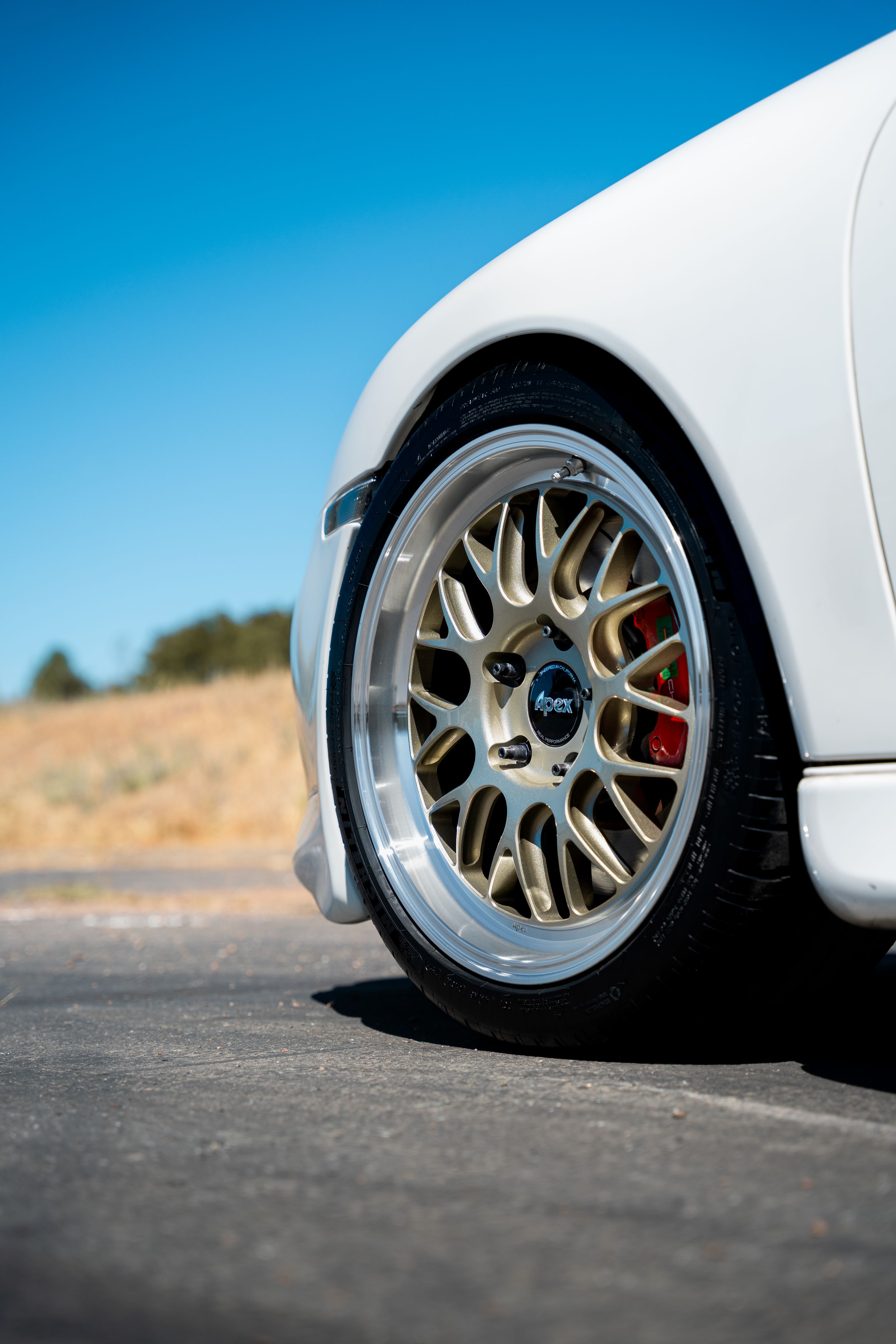 White Porsche 911 996 Carrera with 18" ML-10RT Apex wheels in Machined Lip Gloss Motorsport Gold
