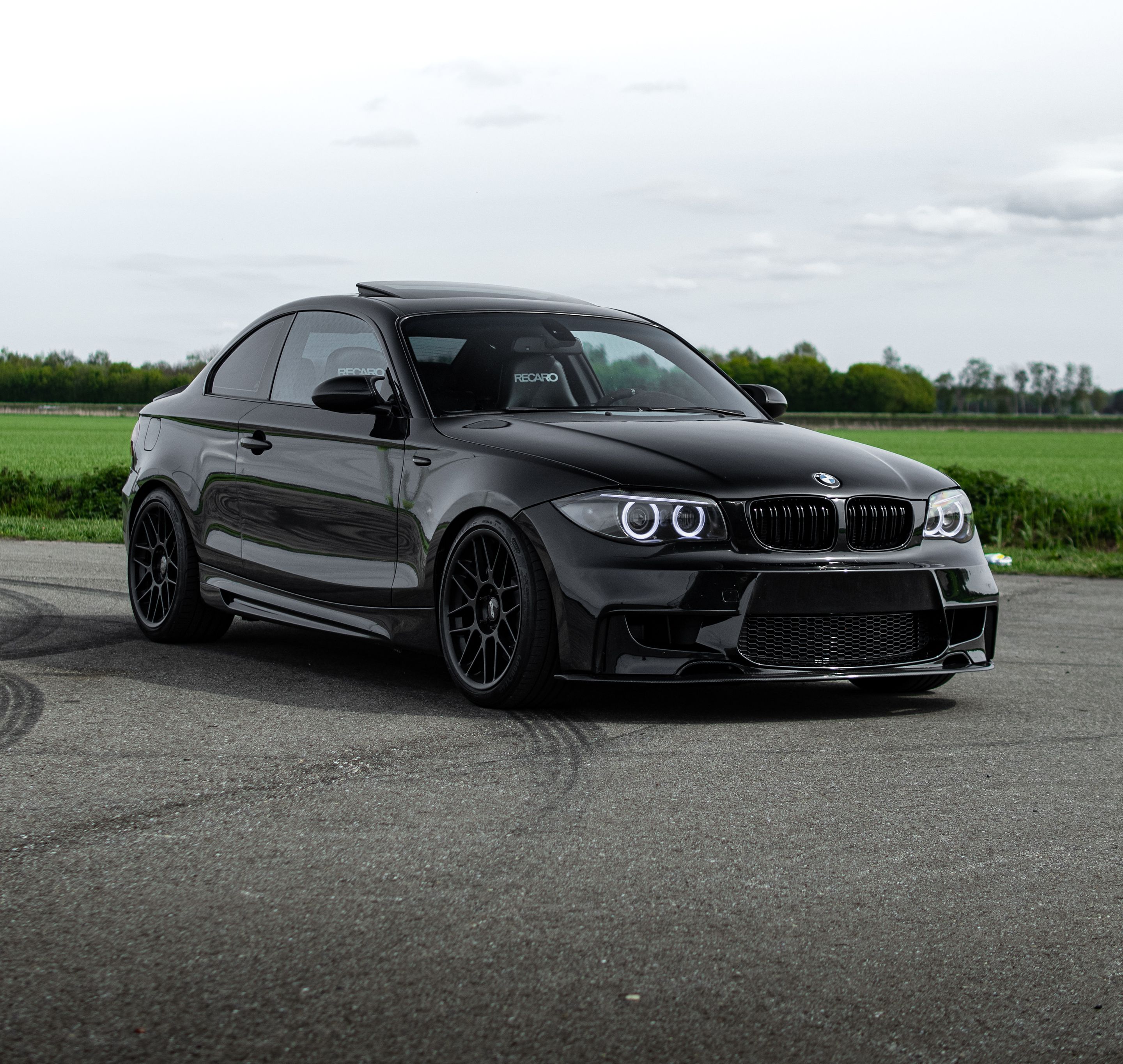 Black BMW E82 Coupe 1 Series with 18" ARC-8 Apex wheels in Satin Black