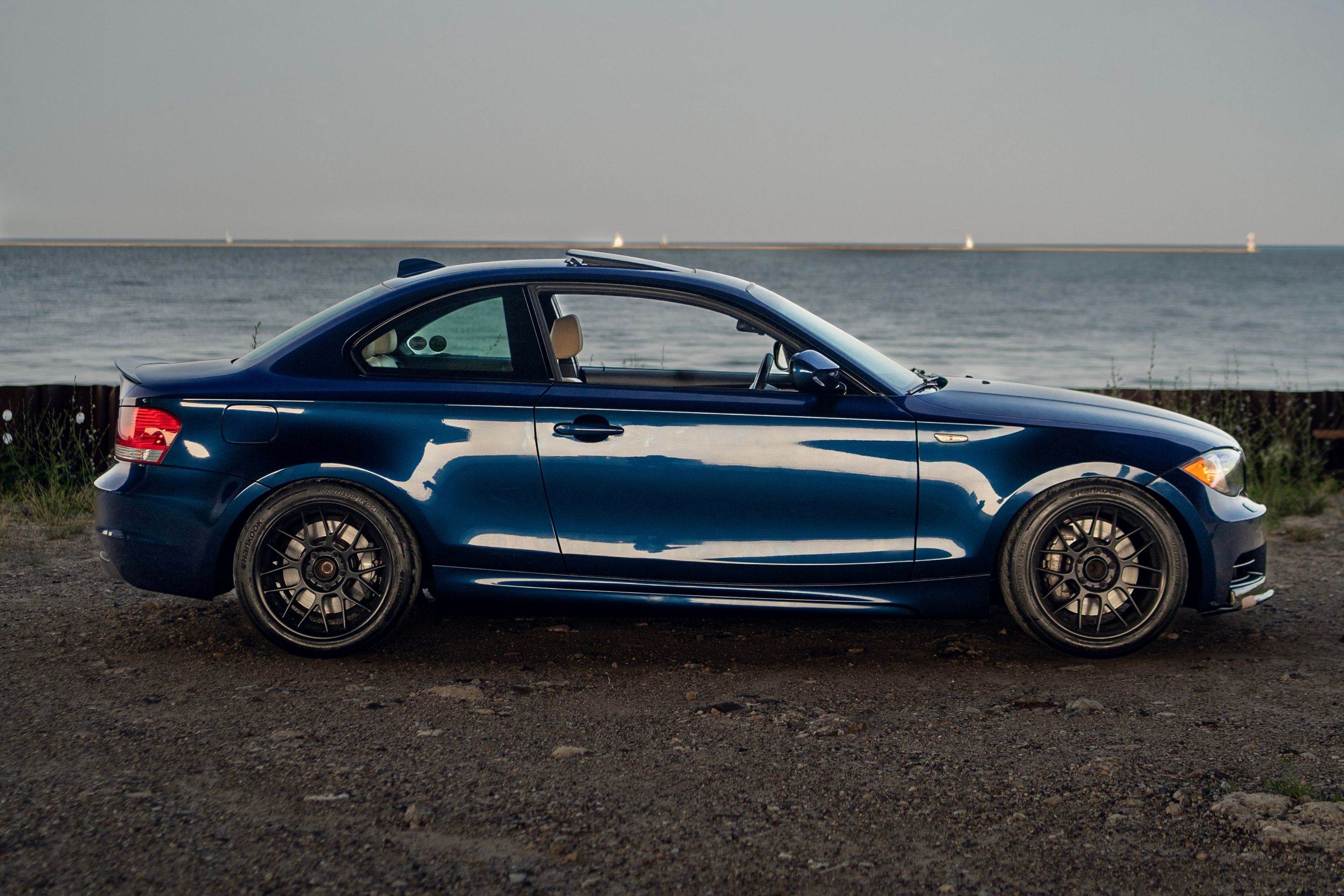 Blue BMW E82 Coupe 1 Series with 17" ARC-8 Apex wheels in Satin Black