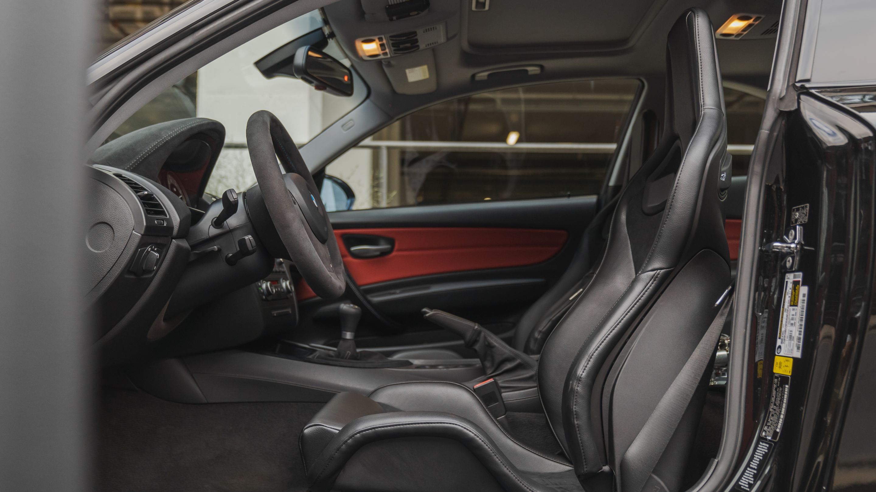 Black BMW E82 Coupe 1 Series with 18" VS-5RS Apex wheels in Motorsport Gold