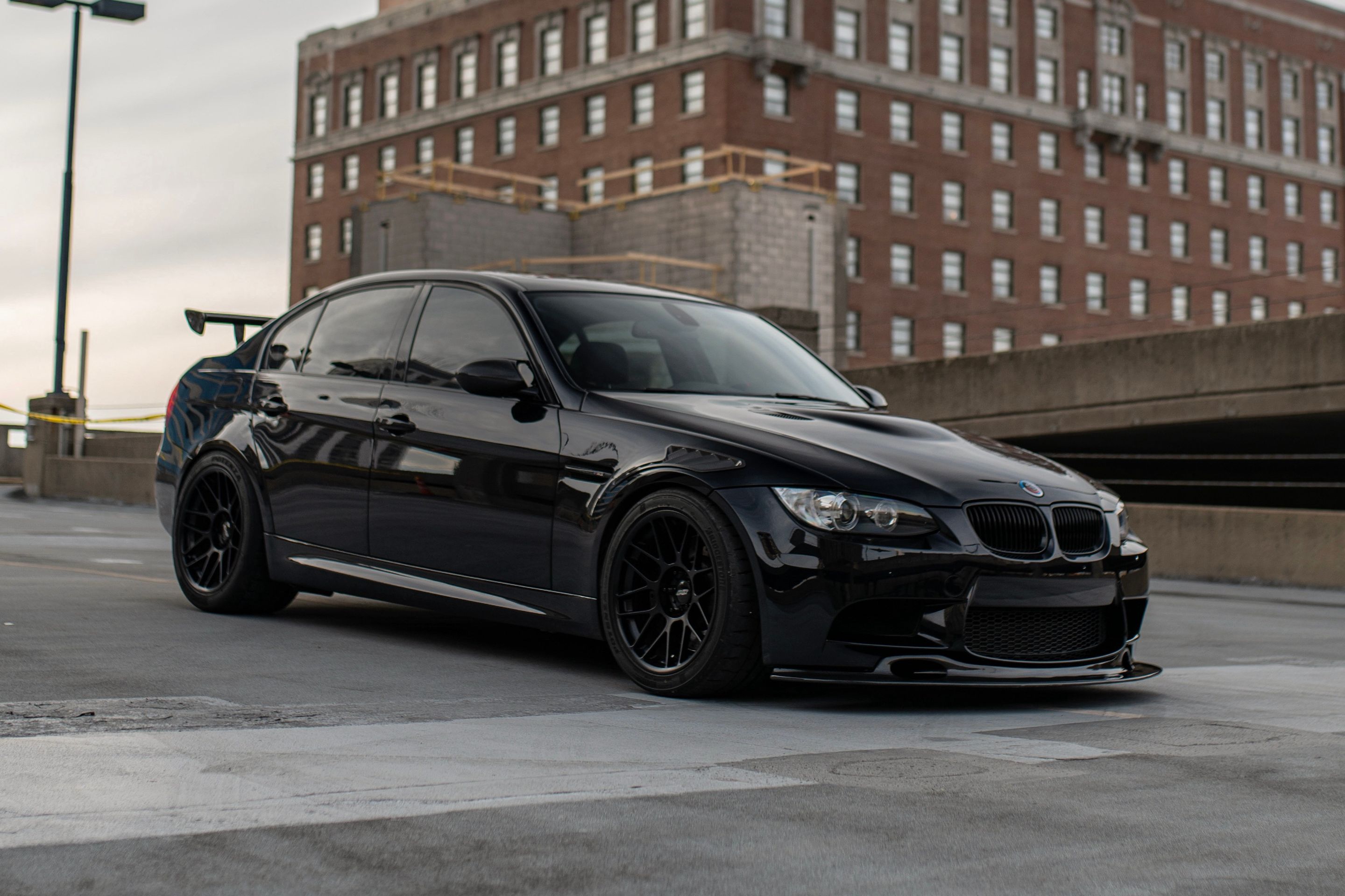 Black BMW E90 Sedan M3 with 18" ARC-8 Apex wheels in Satin Black
