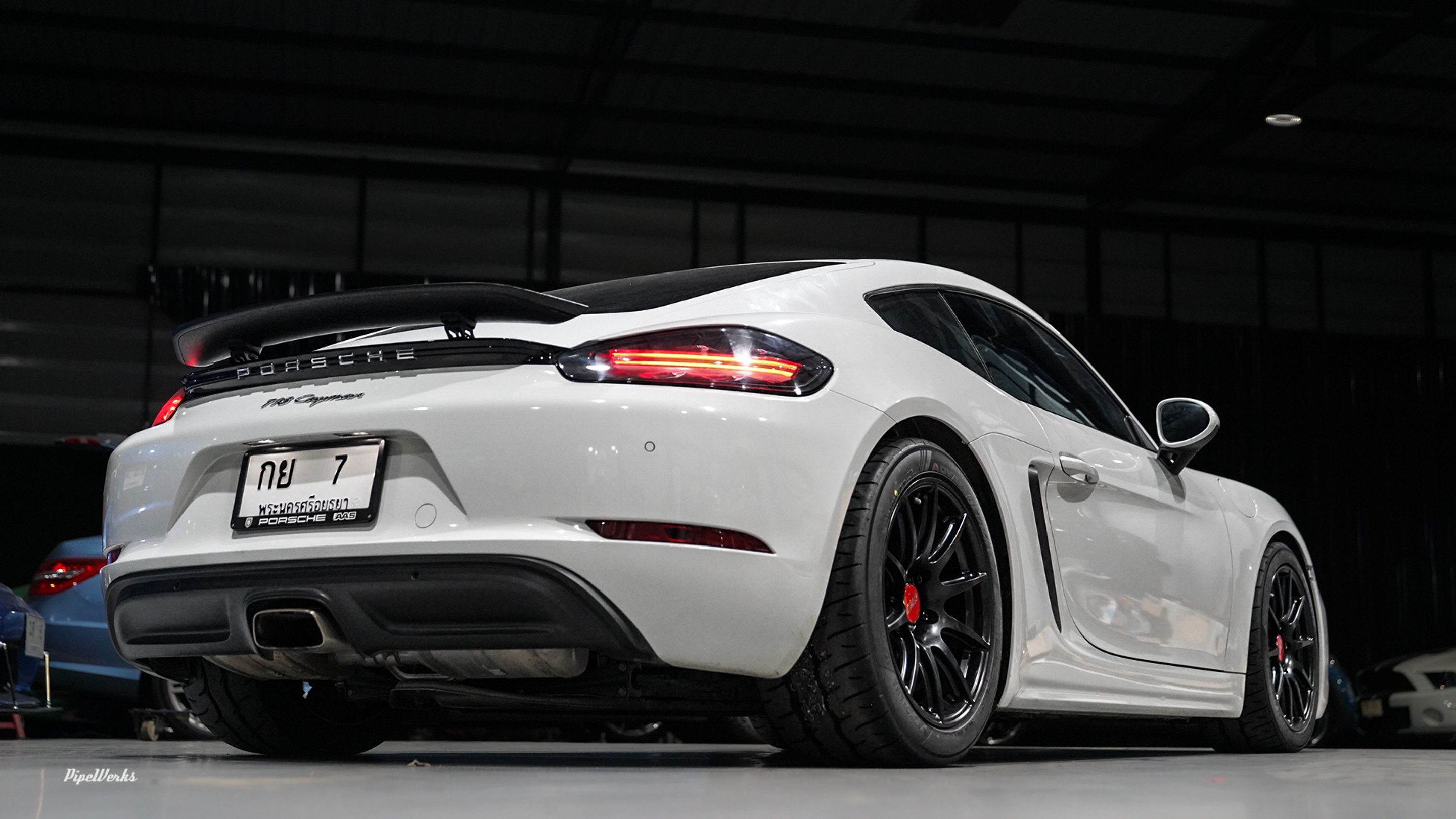 White Porsche 718 Cayman Base with 18" SM-10 Apex wheels in Satin Black