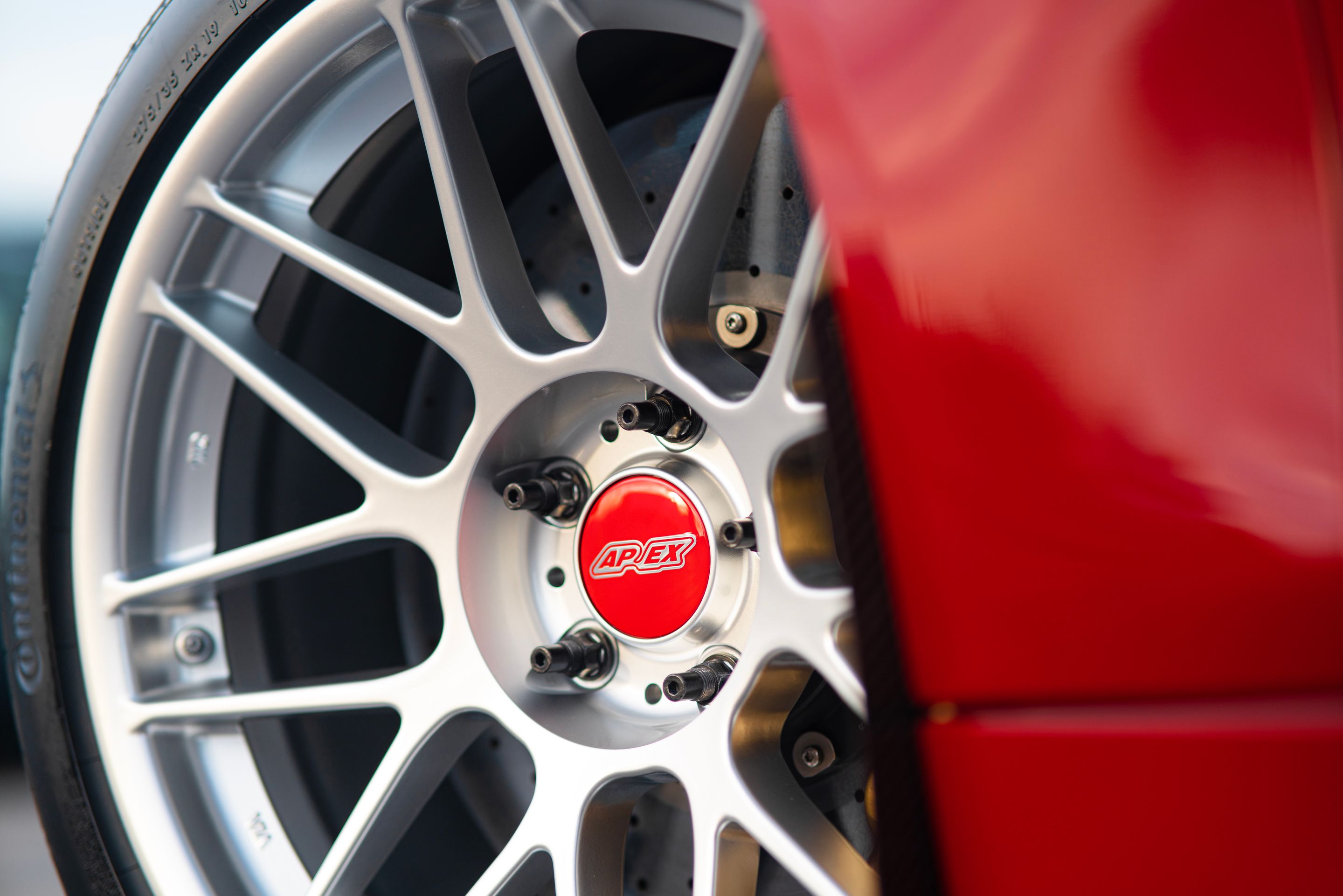 Red BMW F82 Coupe M4 with 19" ARC-8 Apex wheels in Hyper Silver