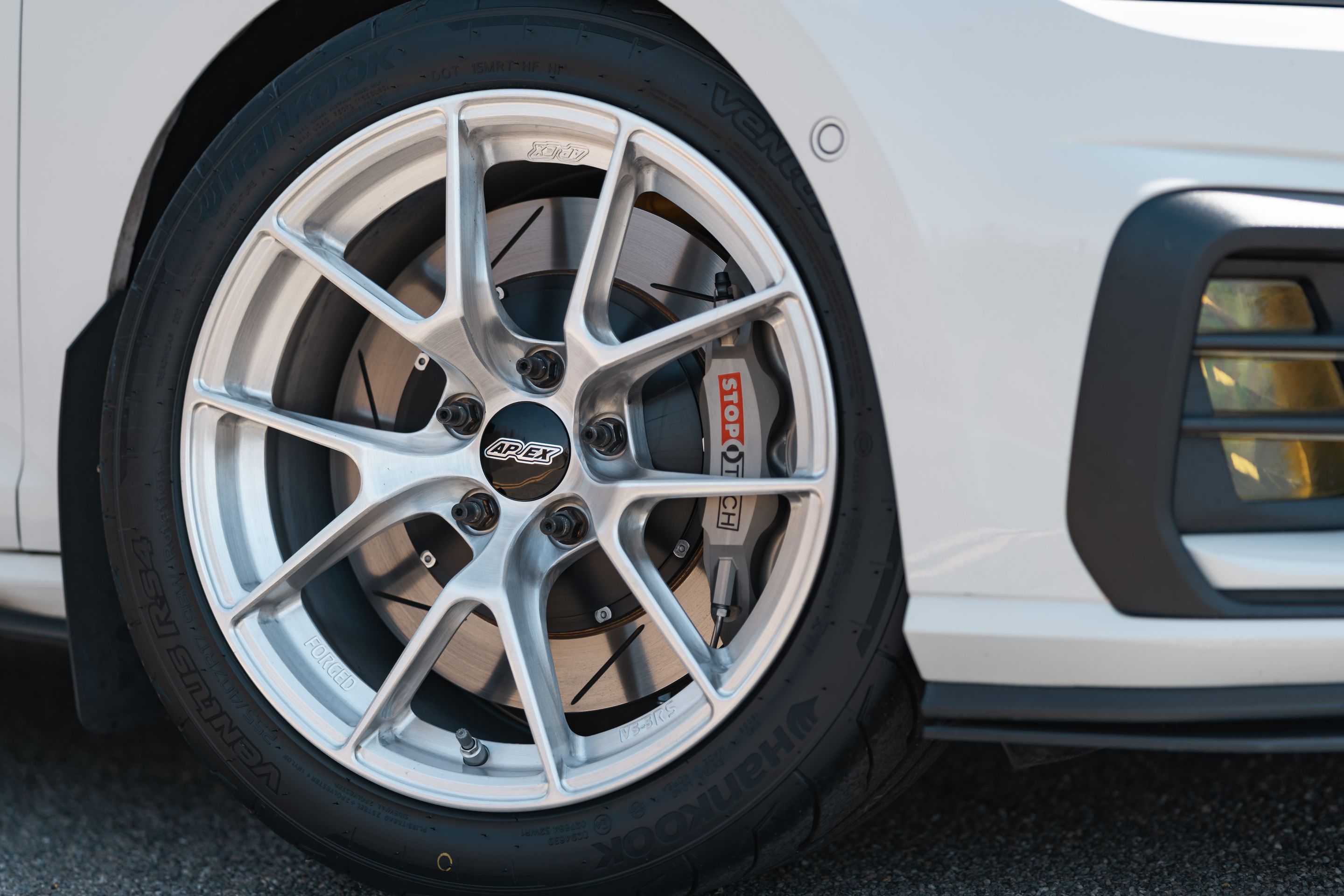 White VW MK7 GTI with 17" VS-5RS Apex wheels in Brushed Clear