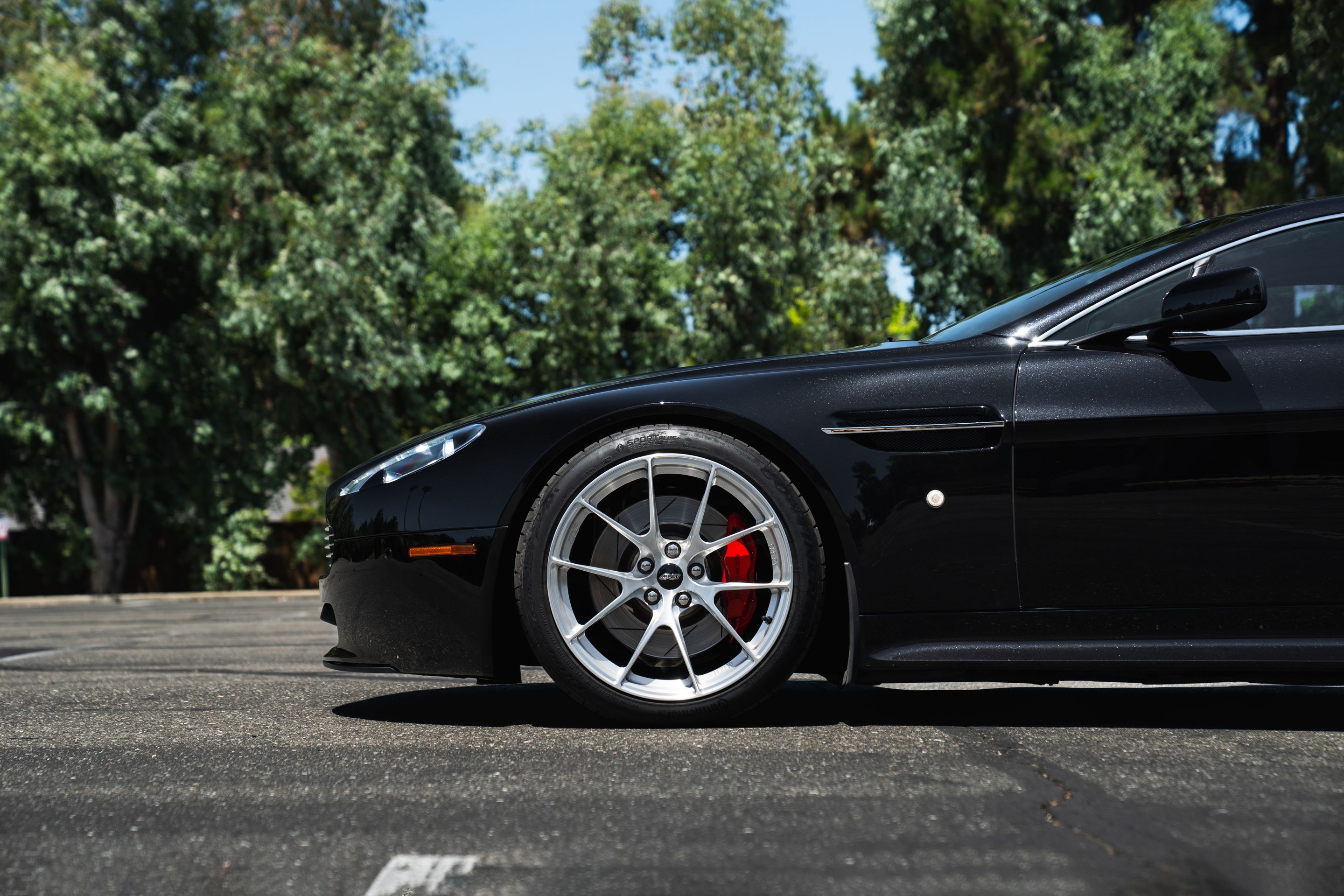 Black Aston Martin V8/V12 Vantage with 19" VS-5RS Apex wheels in Brushed Clear