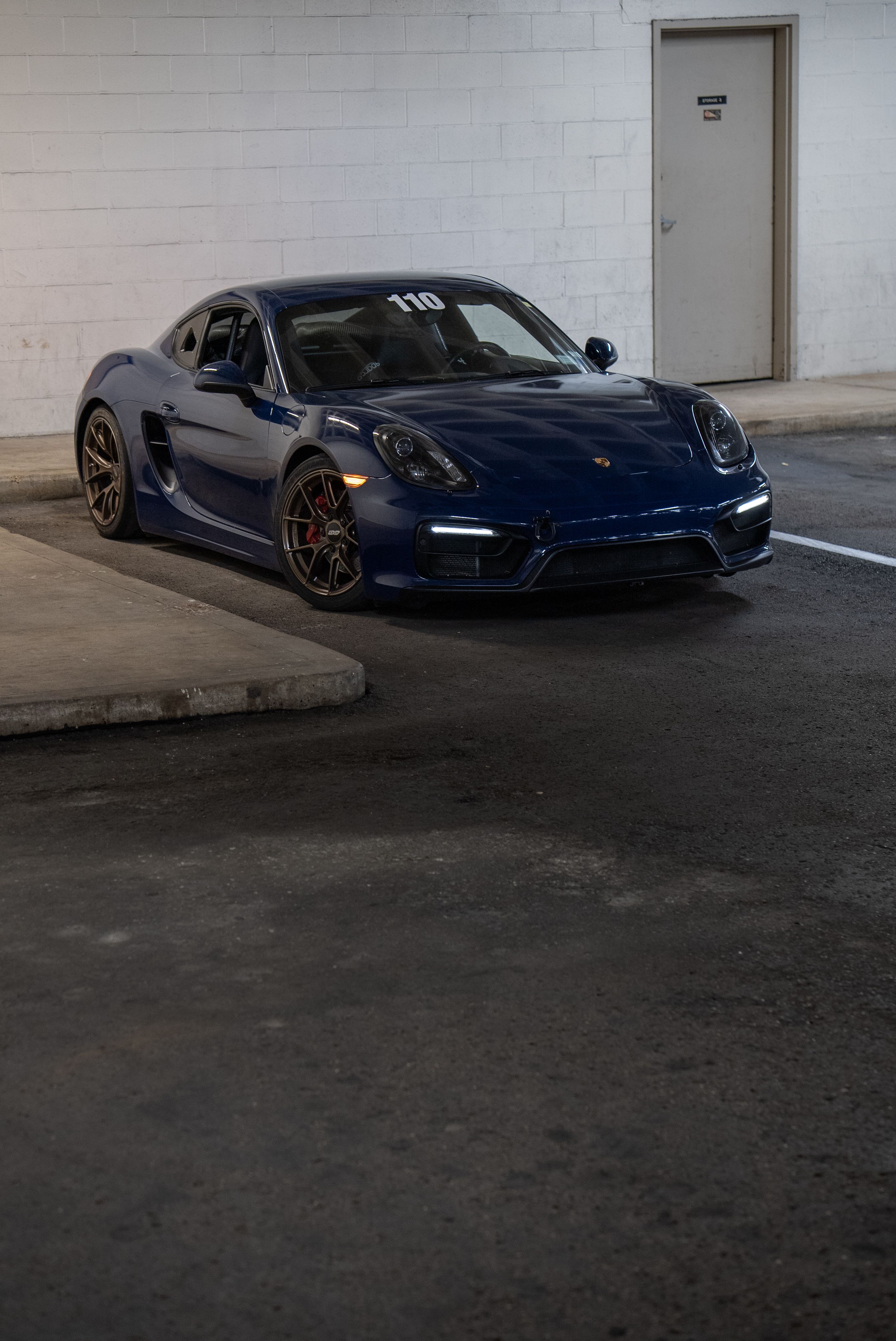 Blue Porsche 981 Cayman GTS with 18" VS-5RS Apex wheels in Satin Bronze