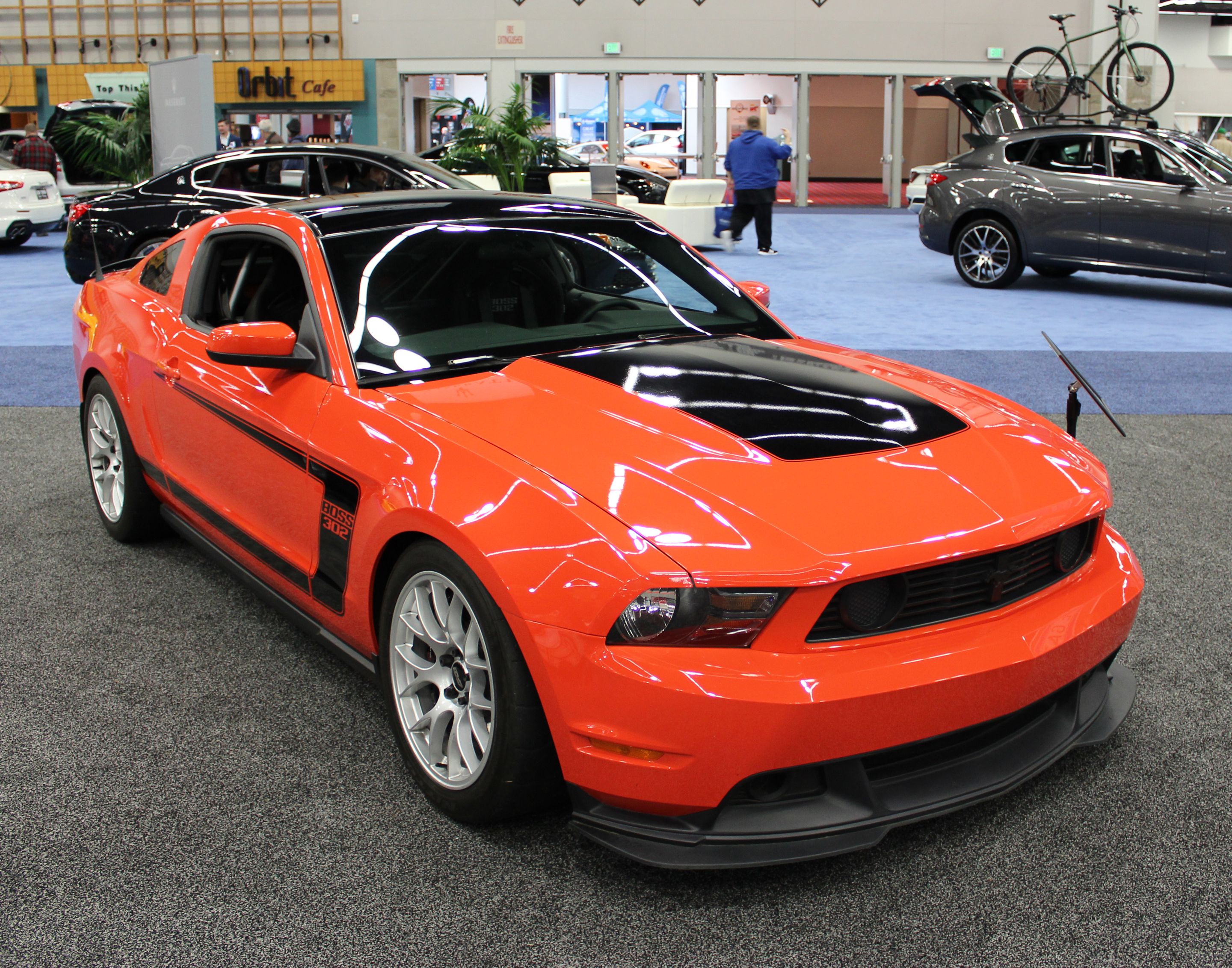 Orange Ford S197 Mustang Boss 302 with 18" EC-7 Apex wheels in Race Silver