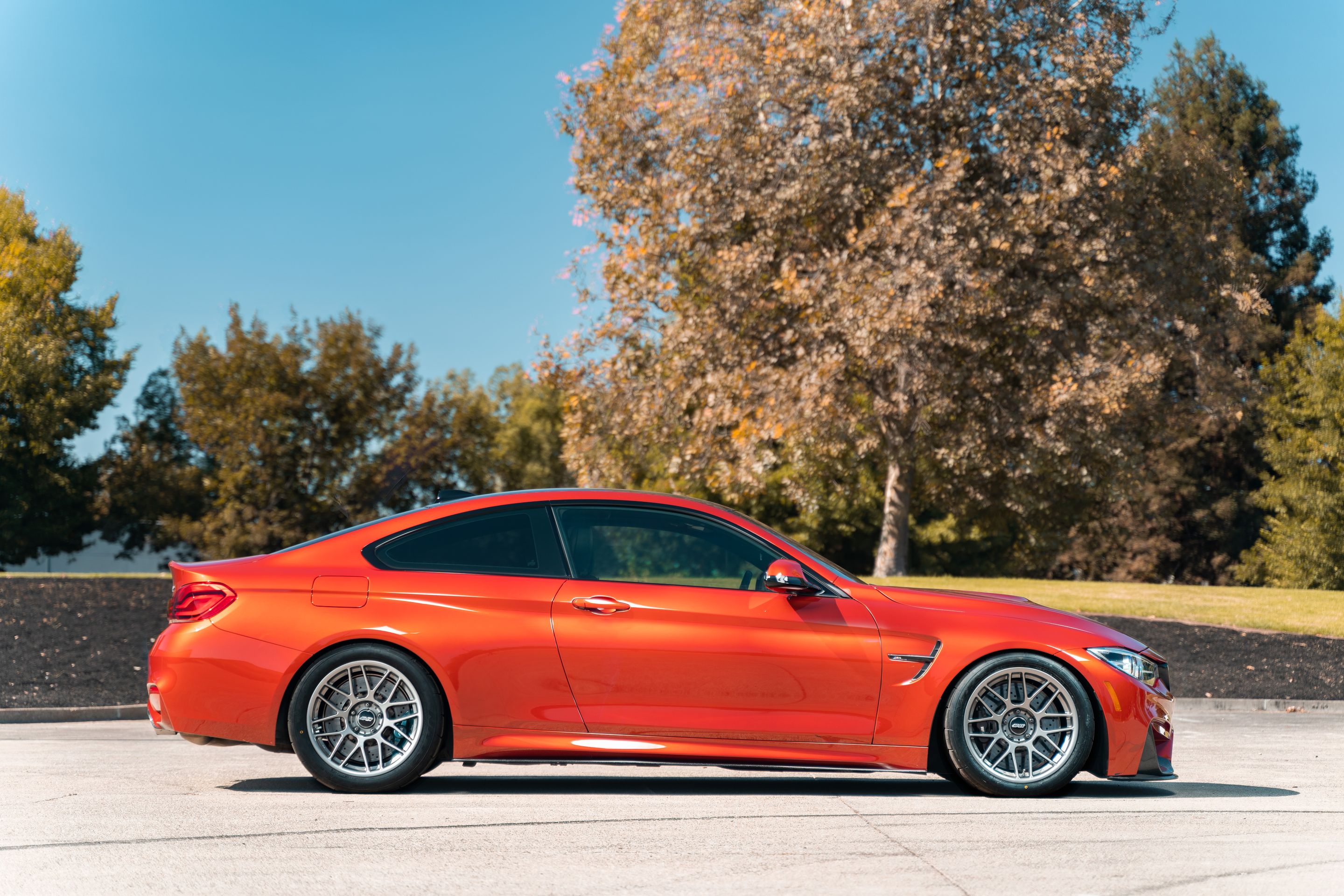 Orange BMW F82 Coupe M4 with 18" ARC-8 Apex wheels in Anthracite