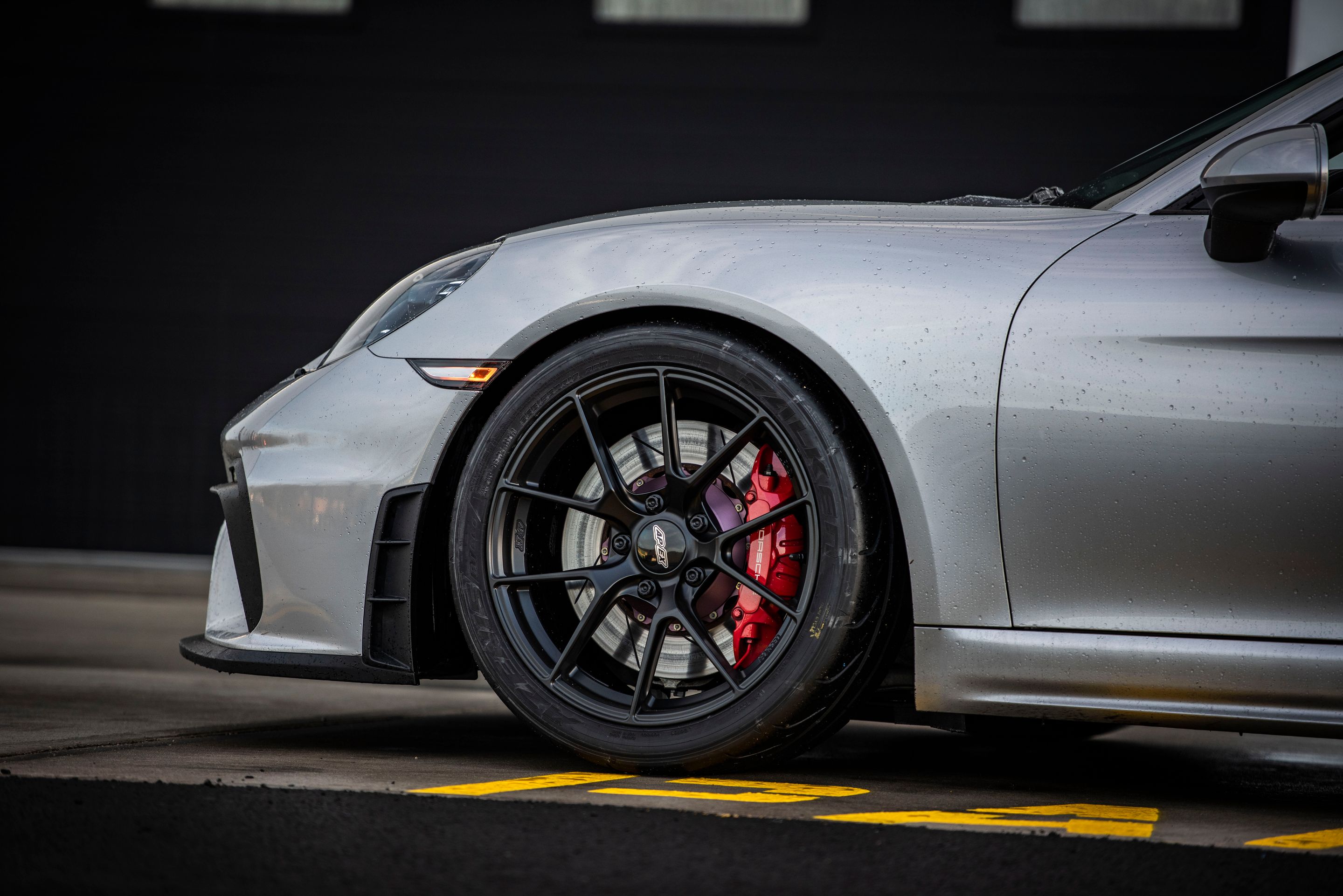 Silver Porsche 718 Cayman GT4 with 19" VS-5RS Apex wheels in Satin Black