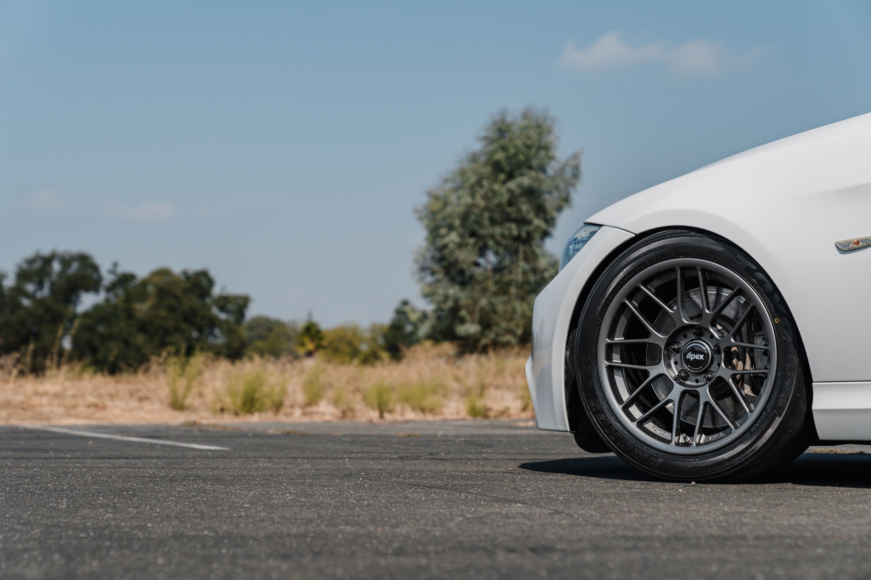 White BMW E90 LCI Sedan 3 Series with 17" ARC-8RT Apex wheels in Anthracite
