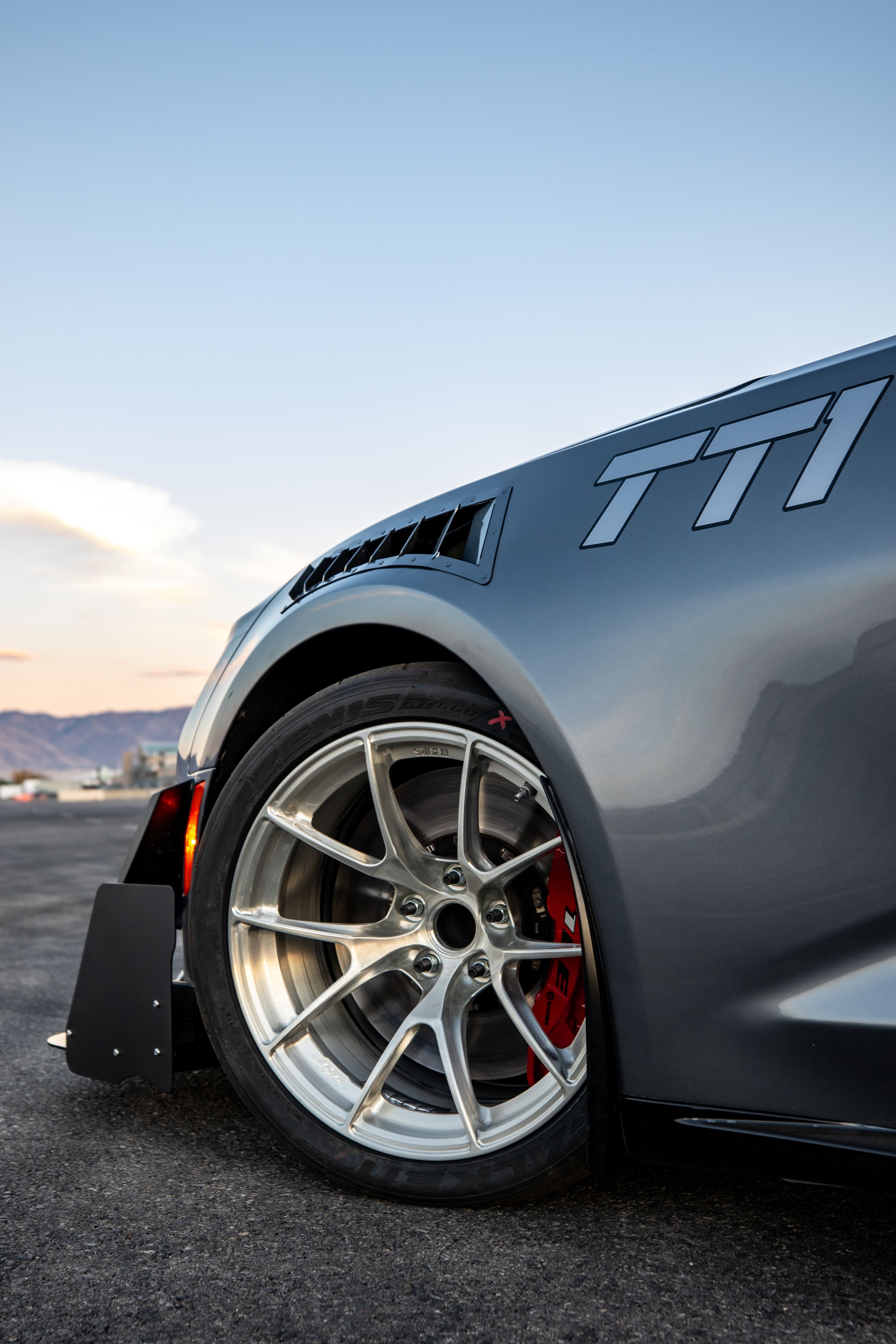 Grey Chevrolet 6th Gen Camaro ZL1 1LE with 18" VS-5RS Apex wheels in Brushed Clear